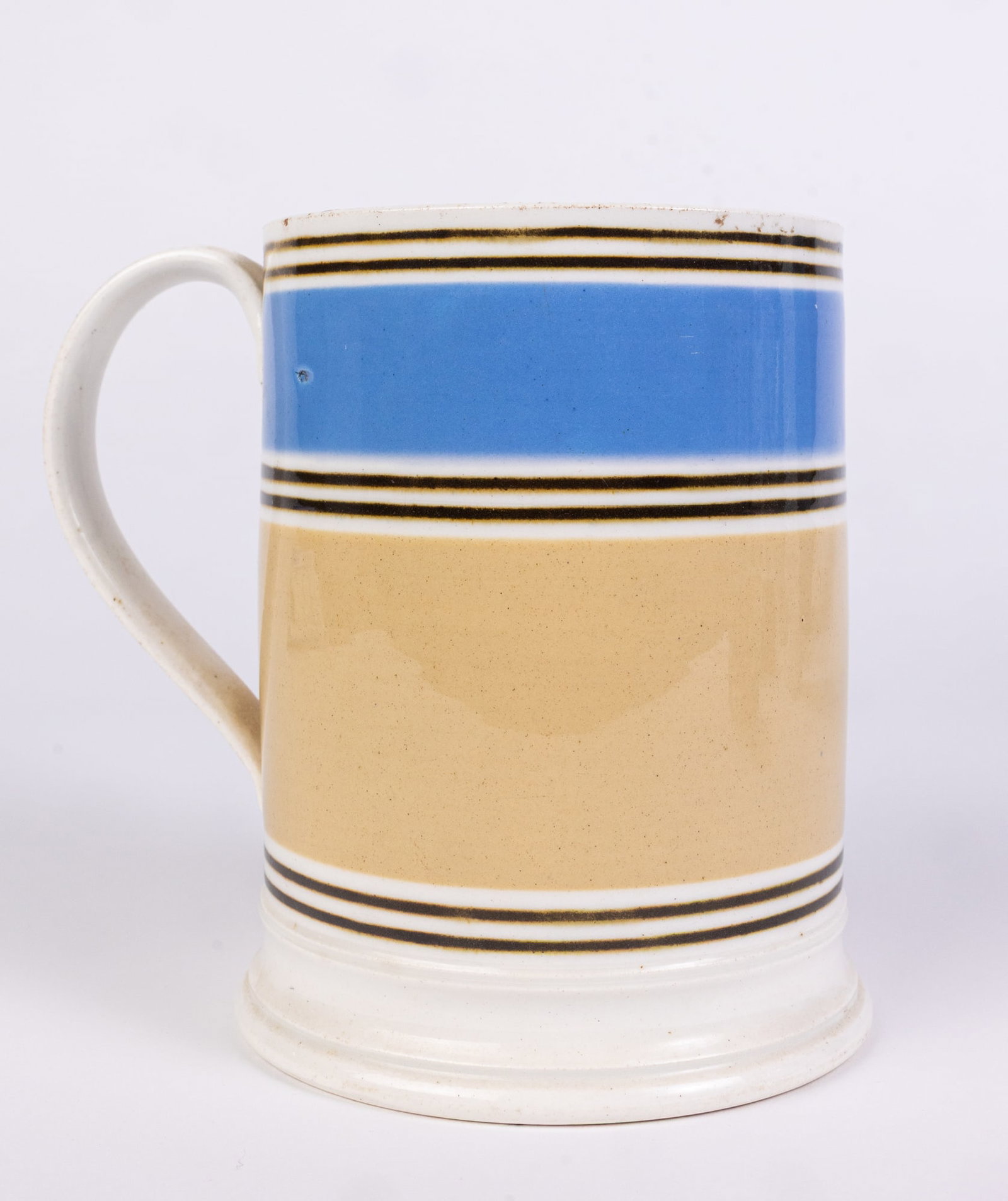 Blue & White Mochaware Mug: Blue & White Mochaware Mug Size 6" H Literature Brooks Auction is not responsible for outbids. Questions? Call the office at (856) 694-2960 or email us directly at info@brooks.auction. •