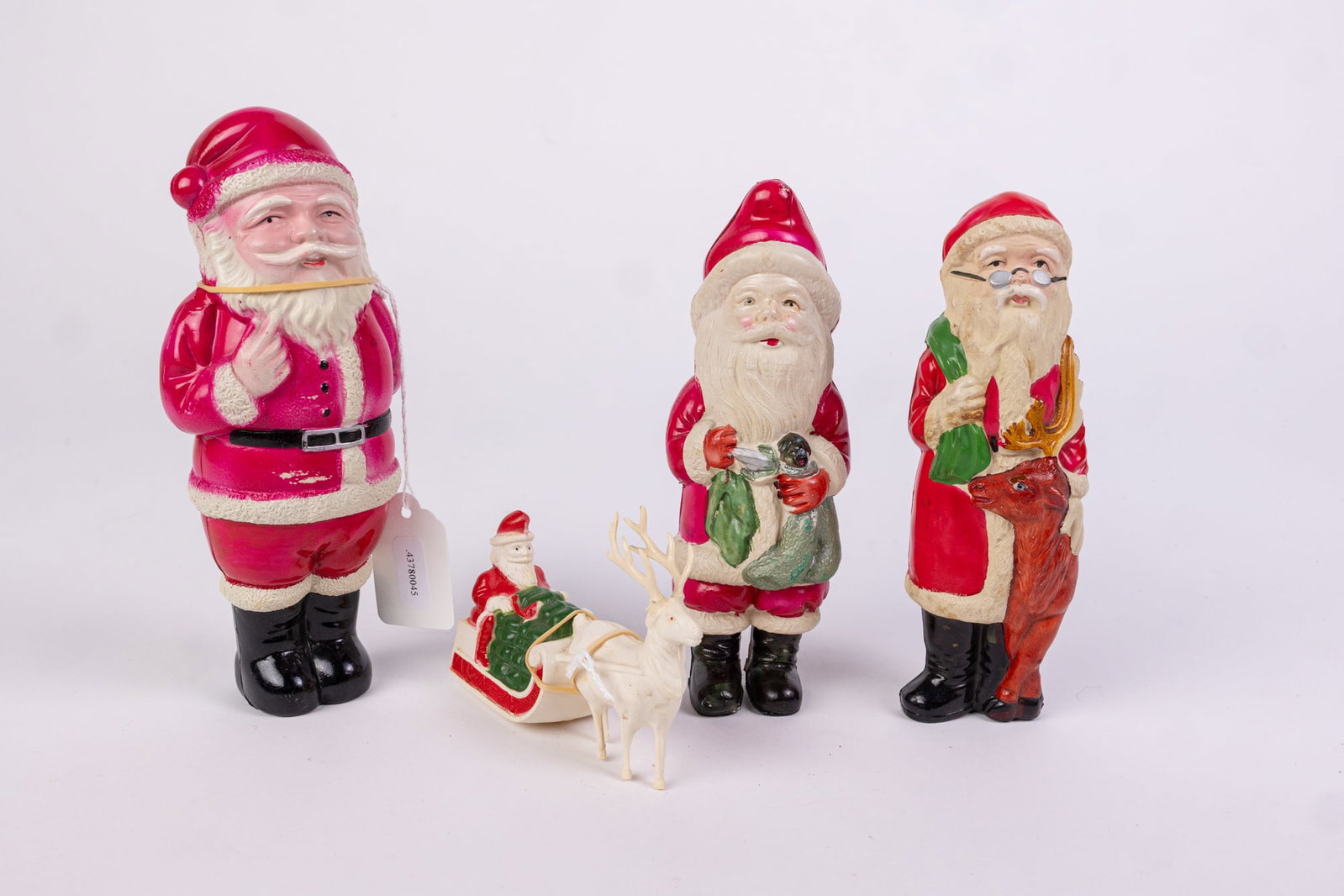 Four Celluloid Vintage Santa Figurines: Four Celluloid Vintage Santa Figurines Size 8" H Literature Brooks Auction is not responsible for outbids. Questions? Call the office at (856) 694-2960 or email us directly at info@brooks.auction.