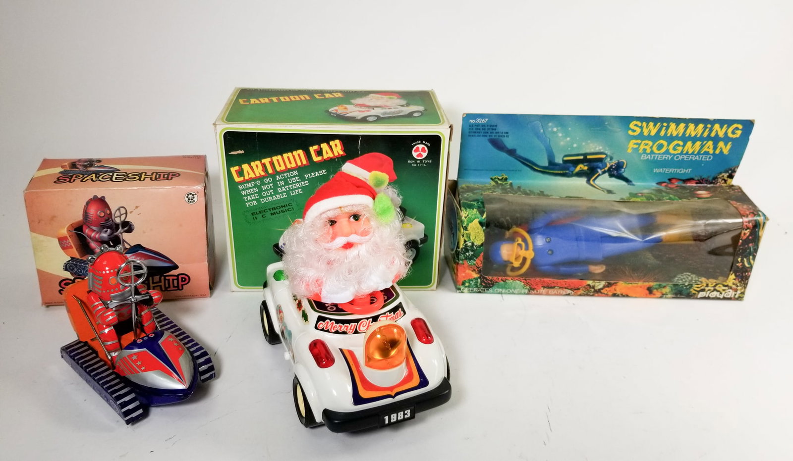 Lot of Vintage Toys: Lot of Vintage Toys: Swimming Frogman no. 3267 in box - son AI toys cartoon Santa car - MS 292 spaceship in box Size 7" x 12" x 12" (box size) Literature Brooks Auction is not responsible for outbids.