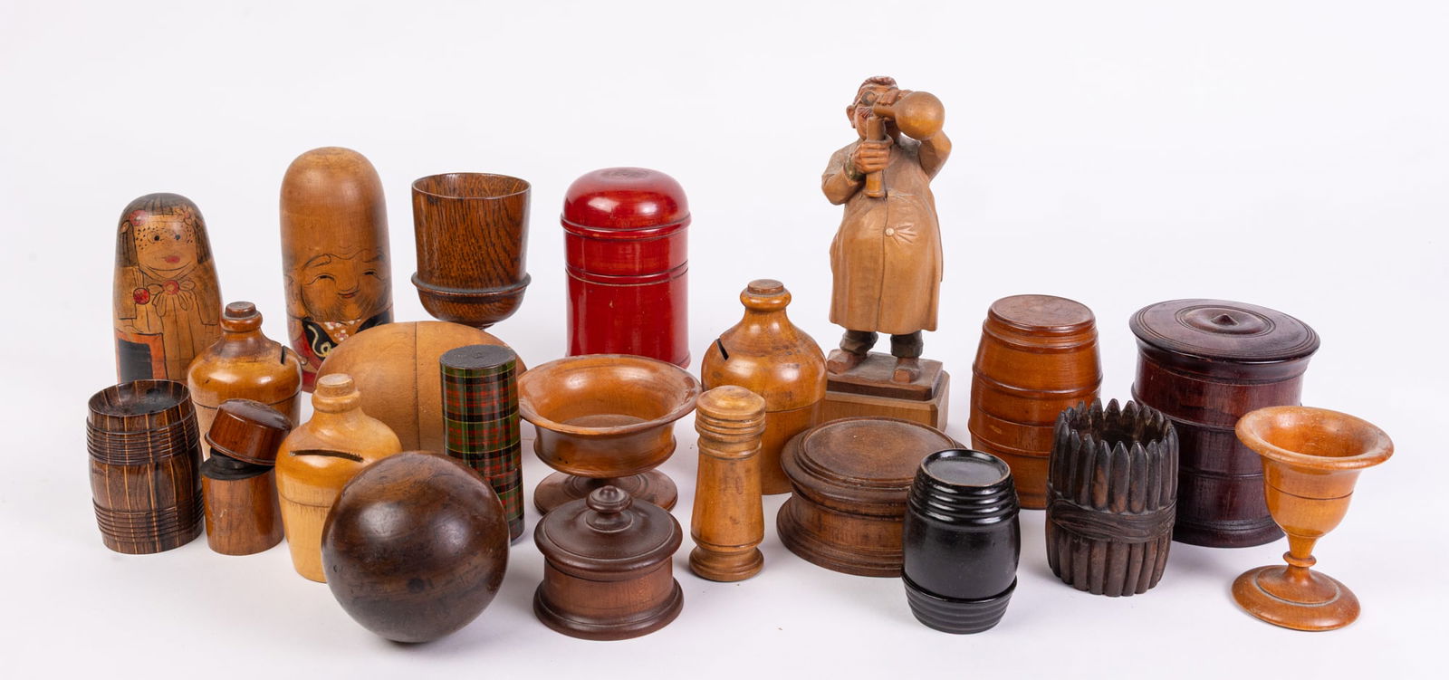Assorted Wooden Vessels and Trinkets: Assorted Wooden Vessels and Trinkets: Russian Nesting Doll - wooden goblet - wooden barrel trinket boxes - Anri wooden figurine - and more Size 7" x 12" x 12" (box size) Literature Brooks Auction is