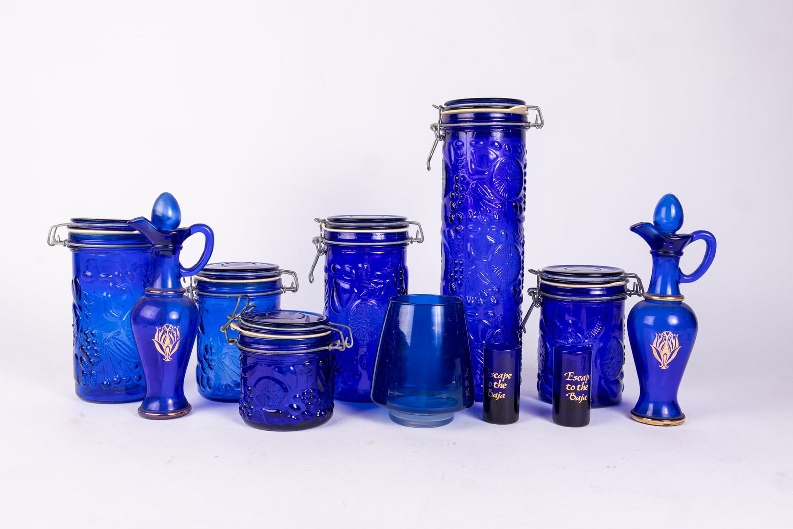 Cobalt Glass Assortment Lot Featuring Fruit Motif Canisters: Cobalt Glass Assortment Lot Featuring Fruit Motif Canisters Size 7" x 12" x 12" Literature Brooks Auction is not responsible for outbids. Questions? Call the office at (856) 694-2960 or email us dir