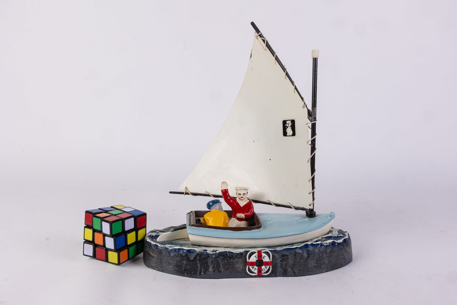 The Cat Boat Sailboat Bank: The Cat Boat Sailboat Bank Size 12.5" Literature Brooks Auction is not responsible for outbids. Questions? Call the office at (856) 694-2960 or email us directly at info@brooks.auction. ̶