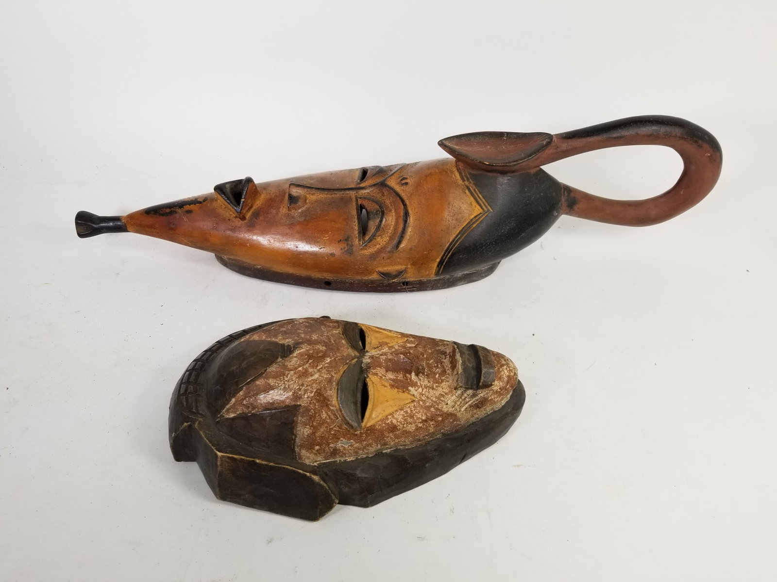 Pair of Decorative African Tribal Carved Wood Mask feat Elongated 2ft Mask: Pair of Decorative African Tribal Carved Wood Mask feat Elongated 2ft Mask Size 24" H Literature Brooks Auction is not responsible for outbids. Questions? Call the office at (856) 694-2960 or email