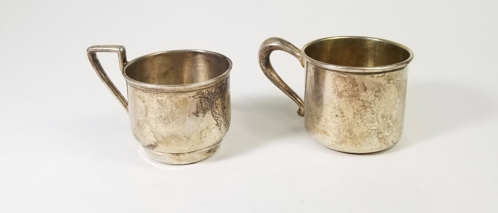 Two Sterling Silver Tea Cups: (2) Sterling Silver Tea Cups: Webster Sterling Silver Tea Cup, engraved Lisa, marked Sterling Web - Sterling Silver Tea Cup, marked sterling. Total weight 67.3 grams Literature Brooks Auction is not
