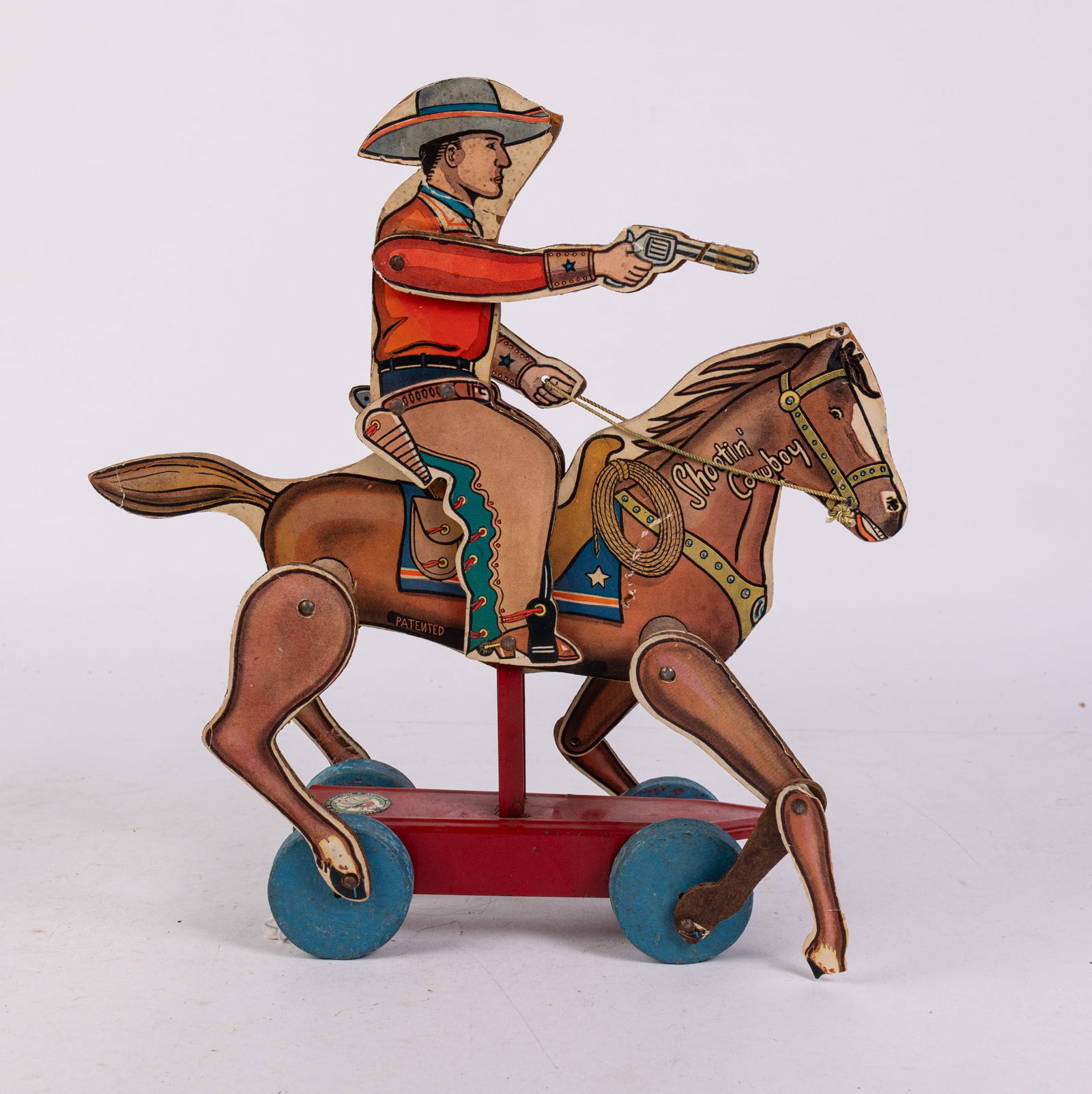 Shootin' Cowboy Vintage Wood and Tin Pull Toy: Shootin' Cowboy Vintage Wood and Tin Pull Toy Size 12" x 12" x 4" Literature Brooks Auction is not responsible for outbids. Questions? Call the office at (856) 694-2960 or email us directly at info@