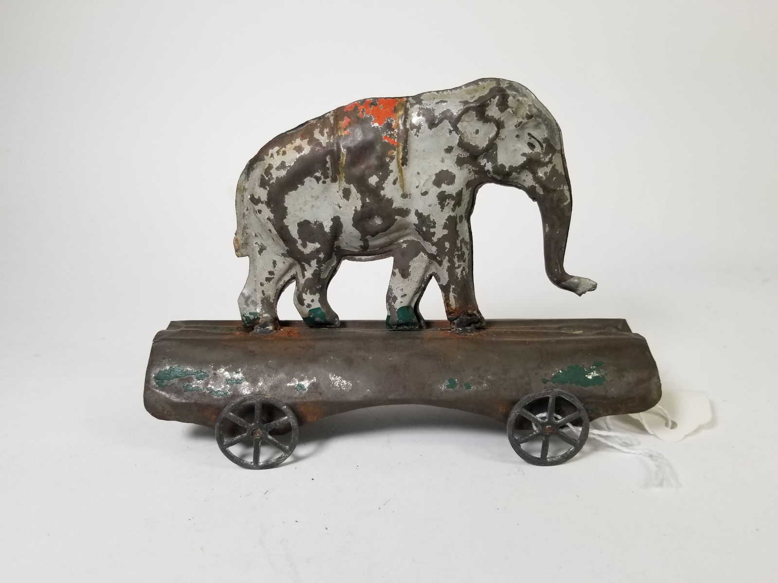 Late 1800s Elephant on Platform Tin Pull Toy: Late 1800s Elephant on Platform Tin Pull Toy Size 5" x 7" x 3" Literature Brooks Auction is not responsible for outbids. Questions? Call the office at (856) 694-2960 or email us directly at info@bro
