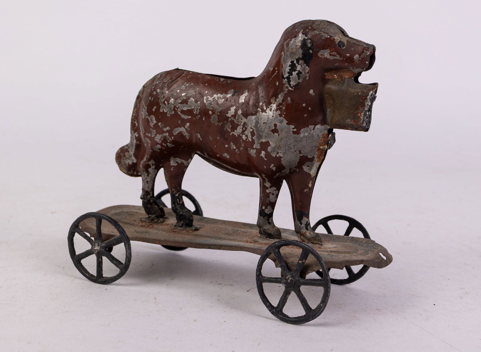 Early Tin "Dog w/ Basket in Mouth" Pull Toy: Early Tin "Dog w/ Basket in Mouth" Pull Toy Size 5" x 7" x 3" Literature Brooks Auction is not responsible for outbids. Questions? Call the office at (856) 694-2960 or email us directly at info@broo