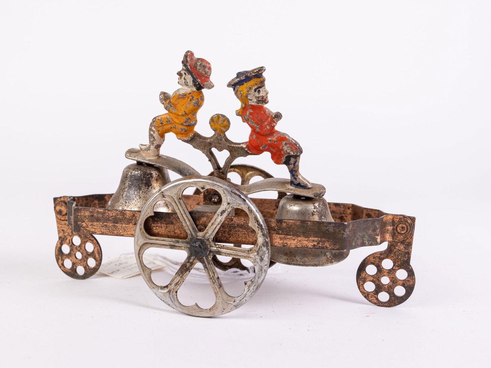 c.1905 Antique Watrous Boy & Girl Chime Bell Toy: c.1905 Antique Watrous Boy & Girl Chime Bell Toy Size 6" x 8" x 3" Literature Brooks Auction is not responsible for outbids. Questions? Call the office at (856) 694-2960 or email us directly at info