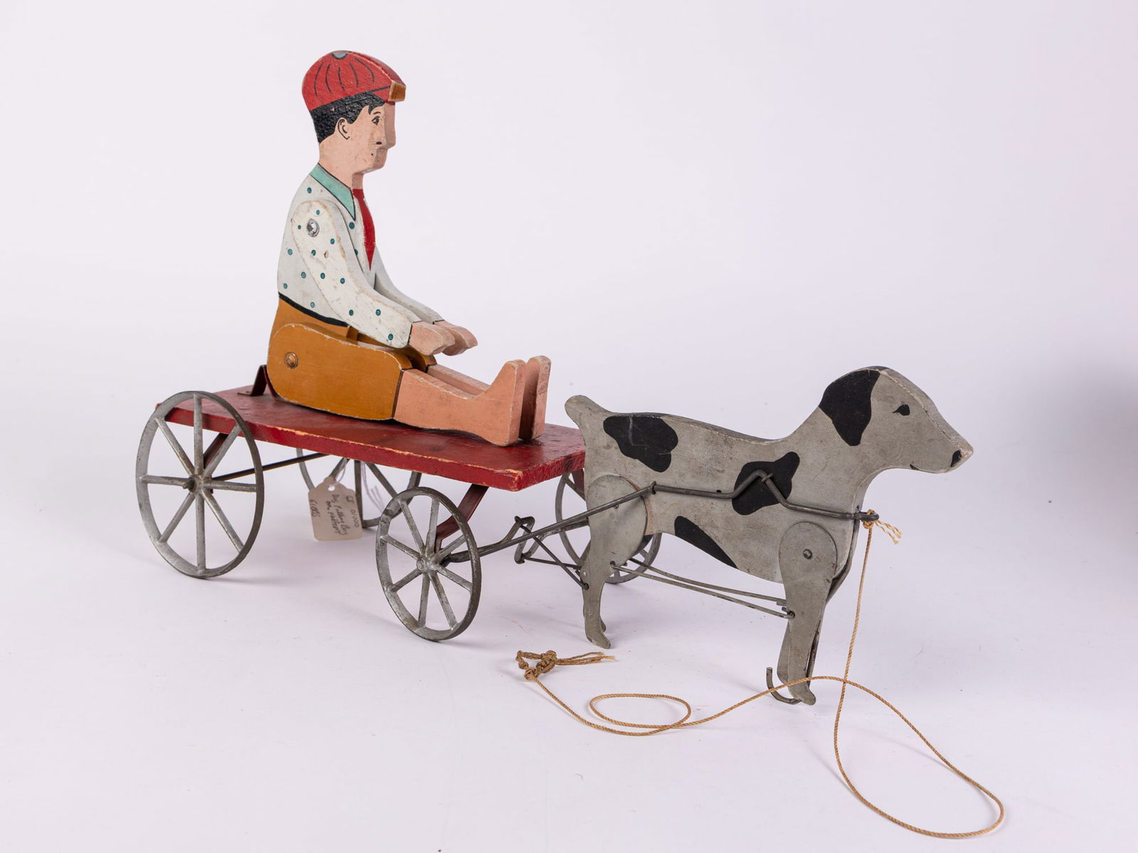 Antique Early Folk Art "Dog Pulling Boy on Platform" Articulated Pull Toy: Antique Early Folk Art "Dog Pulling Boy on Platform" Articulated Pull Toy Size 11" x 17" x 5" Literature Brooks Auction is not responsible for outbids. Questions? Call the office at (856) 694-2960 o