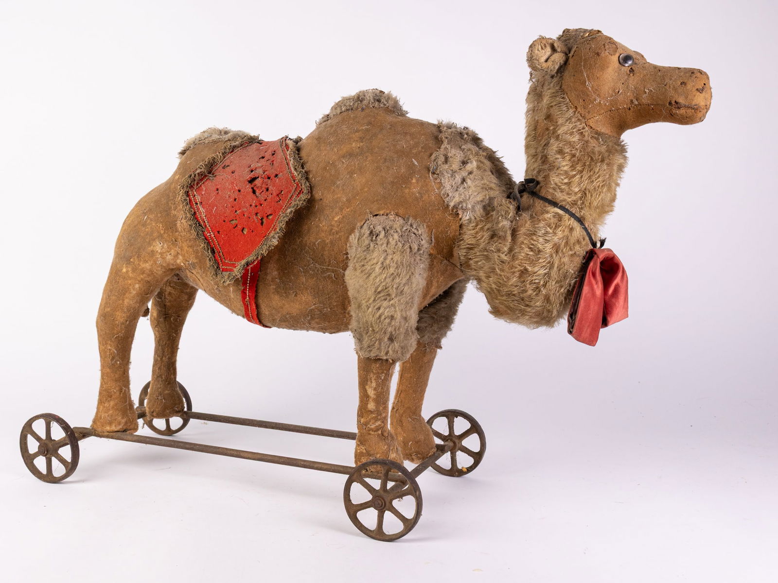 Antique Early Mohair Toy Camel on Wheels: Antique Early Mohair Toy Camel on Wheels Size 20" x 27" x 10" Literature Brooks Auction is not responsible for outbids. Questions? Call the office at (856) 694-2960 or email us directly at info@broo