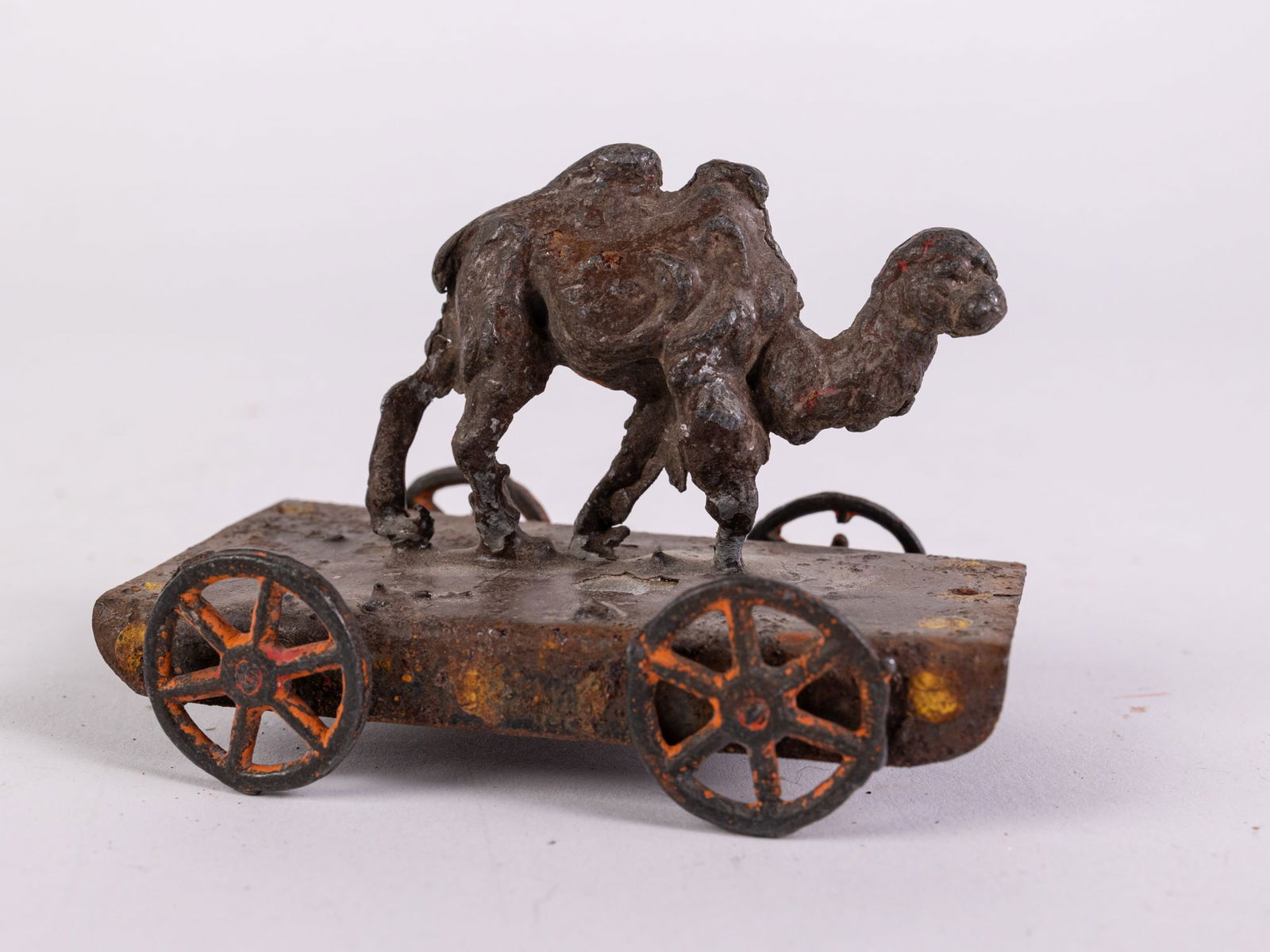 Antique Early Metal Camel on Platform Pull Toy: Antique Early Metal Camel on Platform Pull Toy Size 3" x 3" x 2" Literature Brooks Auction is not responsible for outbids. Questions? Call the office at (856) 694-2960 or email us directly at info@b