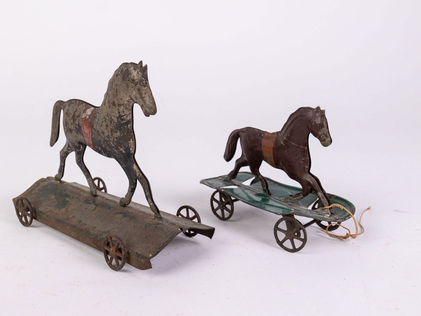 Pair of Early Antique Horse on Platform Tin Pull Toys: Pair of Early Antique Horse on Platform Tin Pull Toys Size 6" x 5" x 3" Literature Brooks Auction is not responsible for outbids. Questions? Call the office at (856) 694-2960 or email us directly at