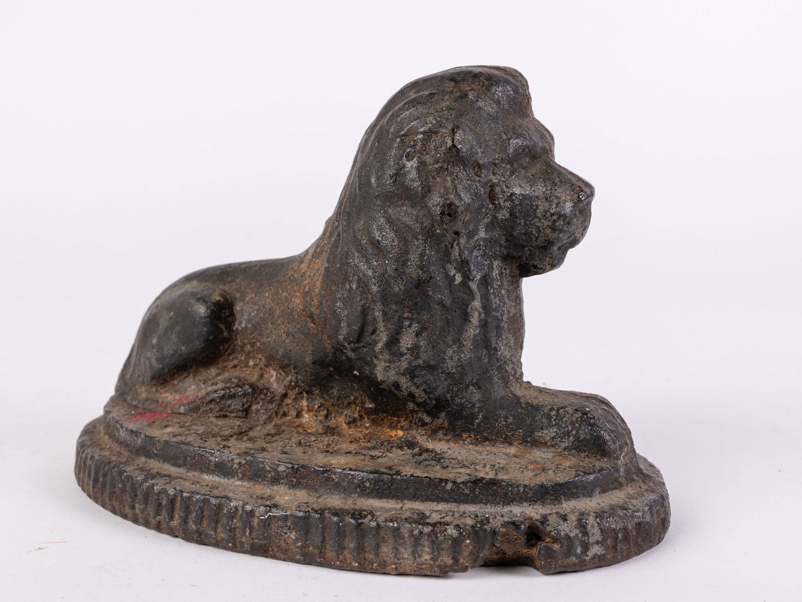 Cast Iron Lion doorstop: Cast Iron Lion doorstop Size 4" x 7" x 4" Literature Brooks Auction is not responsible for outbids. Questions? Call the office at (856) 694-2960 or email us directly at info@brooks.auction. &