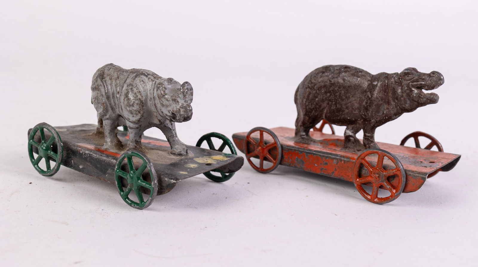 Antique Early Cast Metal Rhino & Hippo on Platform Pull Toys: Antique Early Cast Metal Rhino & Hippo on Platform Pull Toys Size 3" x 2" x 2" Literature Brooks Auction is not responsible for outbids. Questions? Call the office at (856) 694-2960 or email us dire