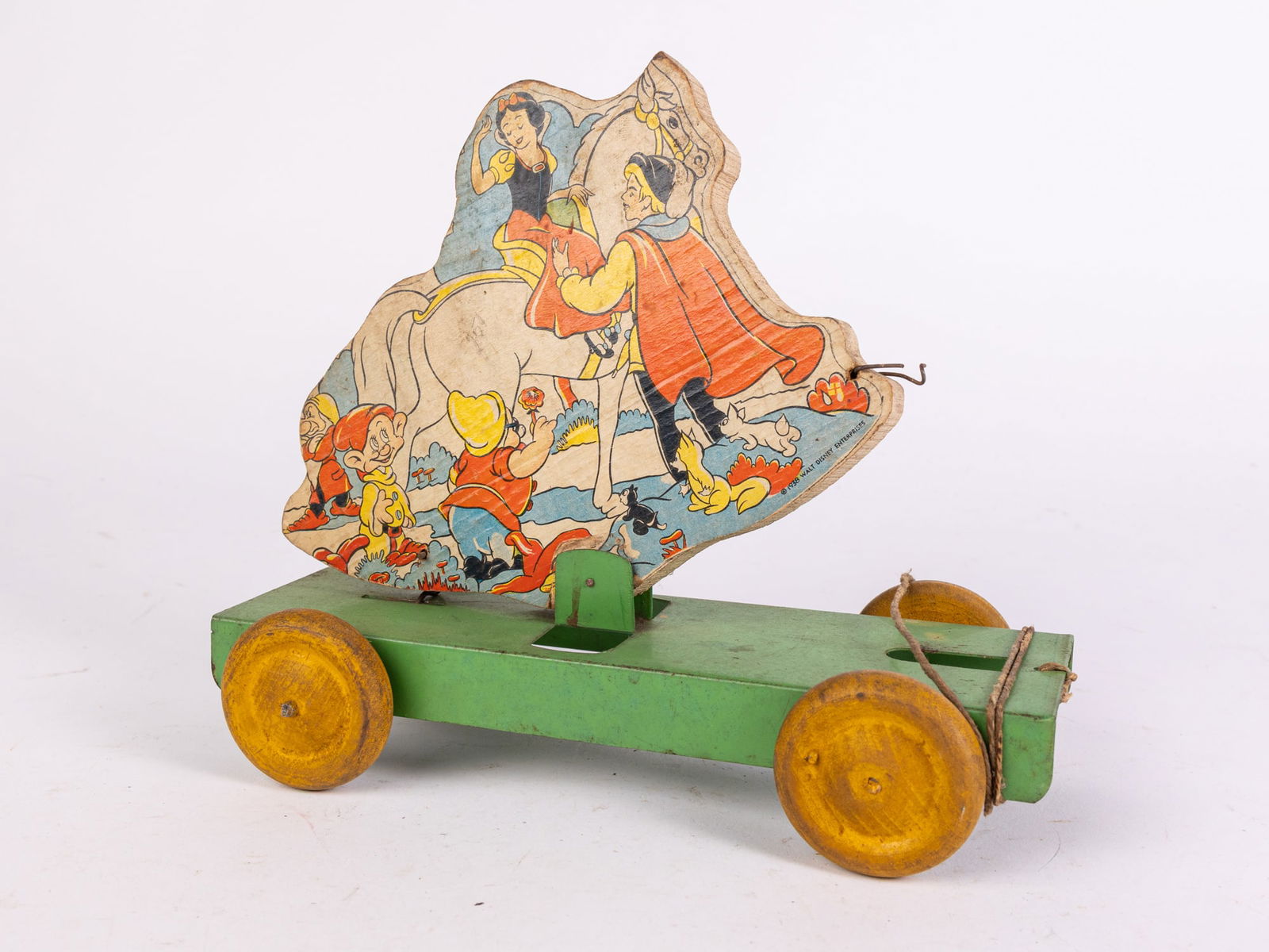 c.1938 Walt Disney Enterprises "Snow White" Paper on Wood Pull Toy (1 of 4)