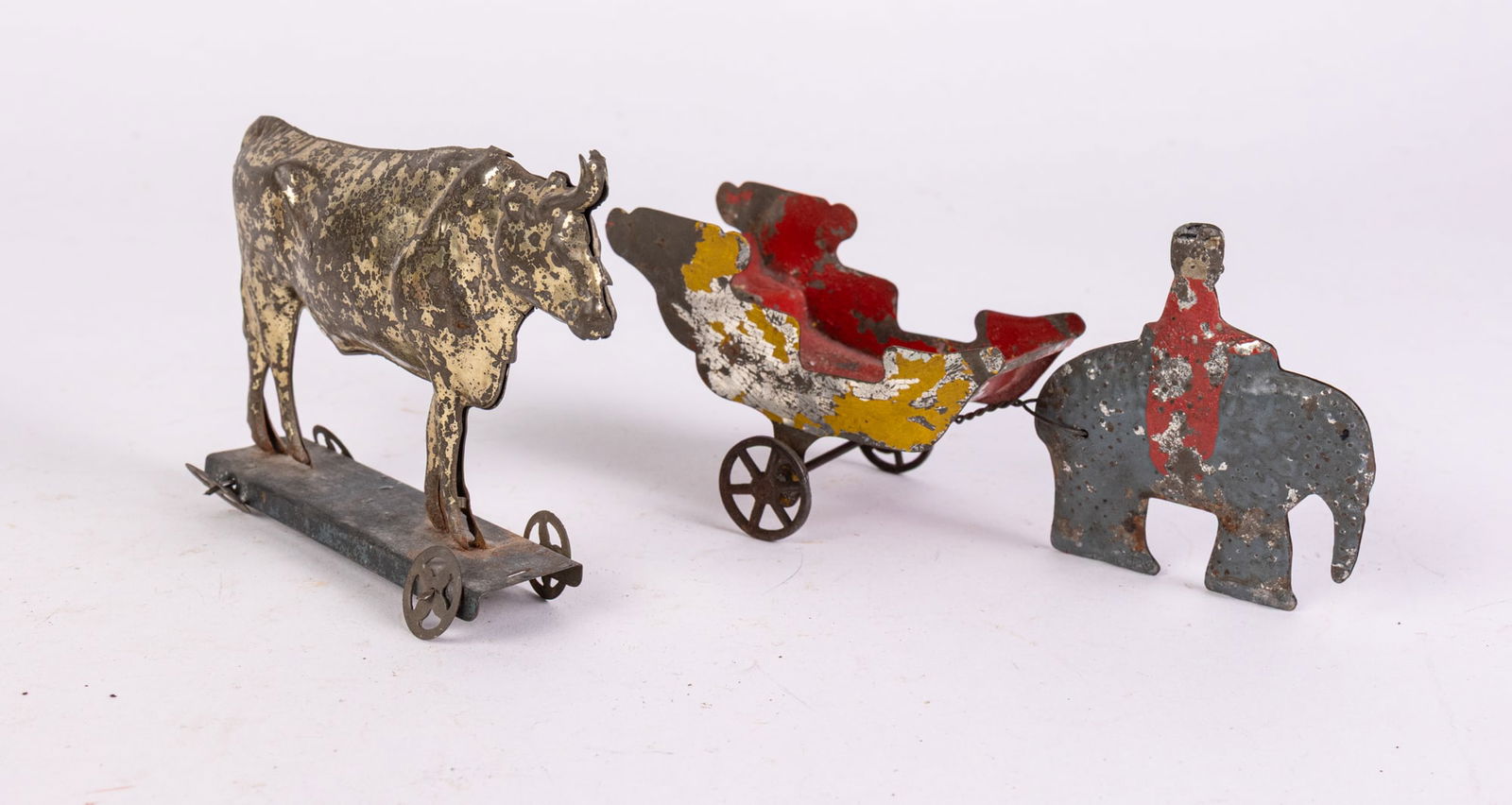 Antique Early Tin Toys ft Bull on Platform & Elephant w/ Wagon: Antique Early Tin Toys ft Bull on Platform & Elephant w/ Wagon Size 4" x 4" x 1" Literature Brooks Auction is not responsible for outbids. Questions? Call the office at (856) 694-2960 or email us di