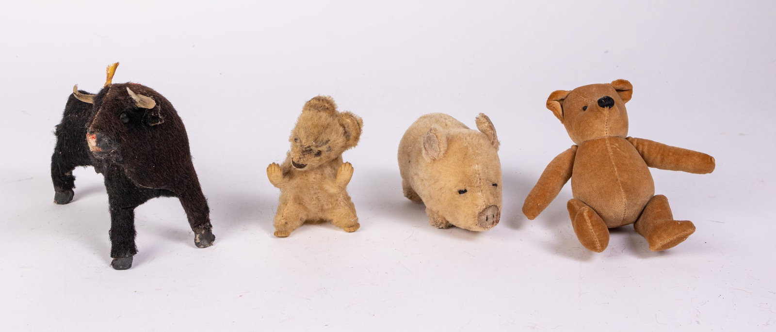 Lot of Vintage Stuffed Animals: Lot of Vintage Stuffed Animals: Dakin stuffed mohair pig - mohair squirrel - Ferdinand the bull - and more Size 5" x 7" x 3" Literature Brooks Auction is not responsible for outbids. Questions? Call