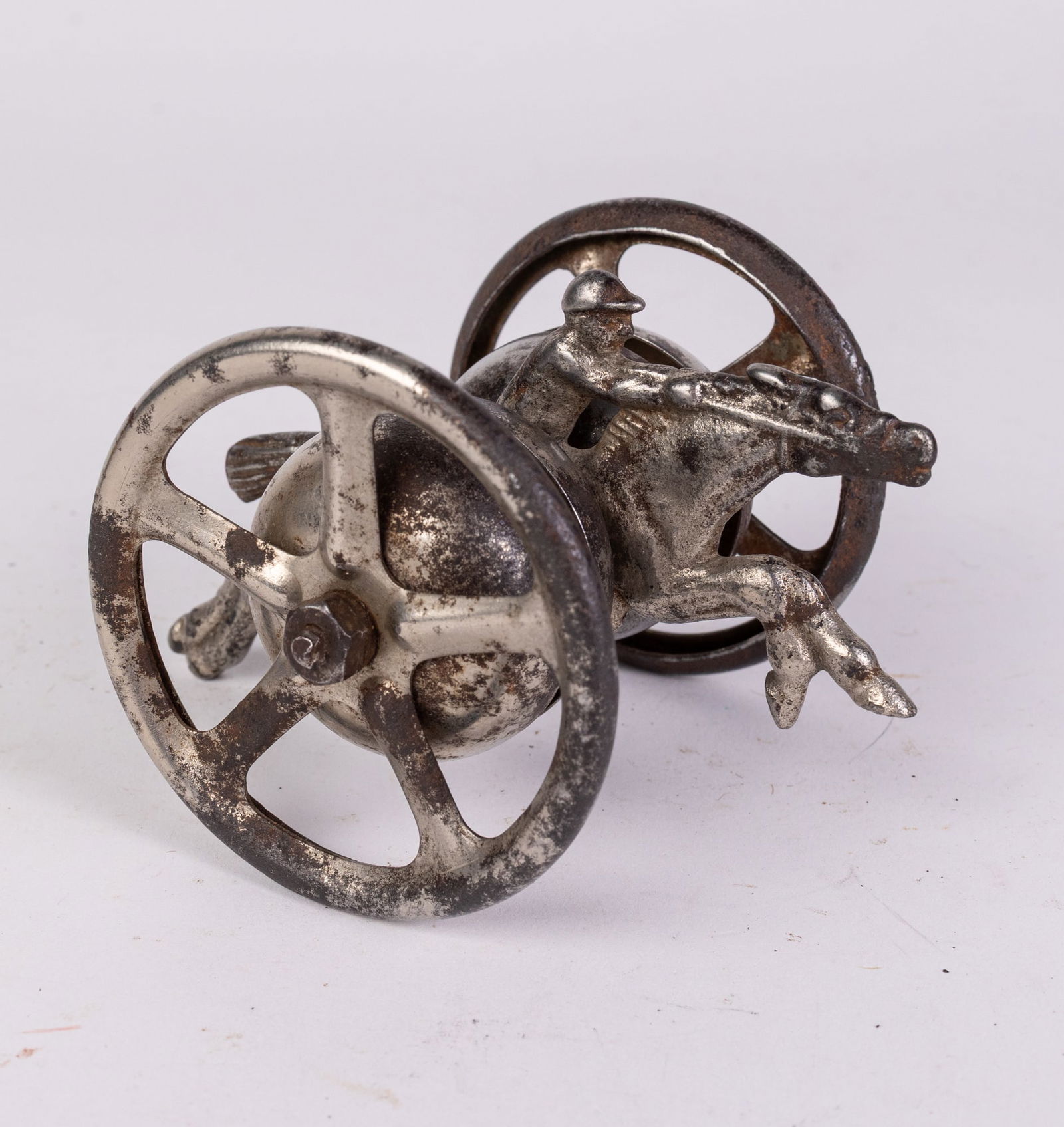 Antique Early Horse & Jockey Bell Toy: Antique Early Horse & Jockey Bell Toy Size 3" x 5" x 4" Literature Brooks Auction is not responsible for outbids. Questions? Call the office at (856) 694-2960 or email us directly at info@brooks.auc