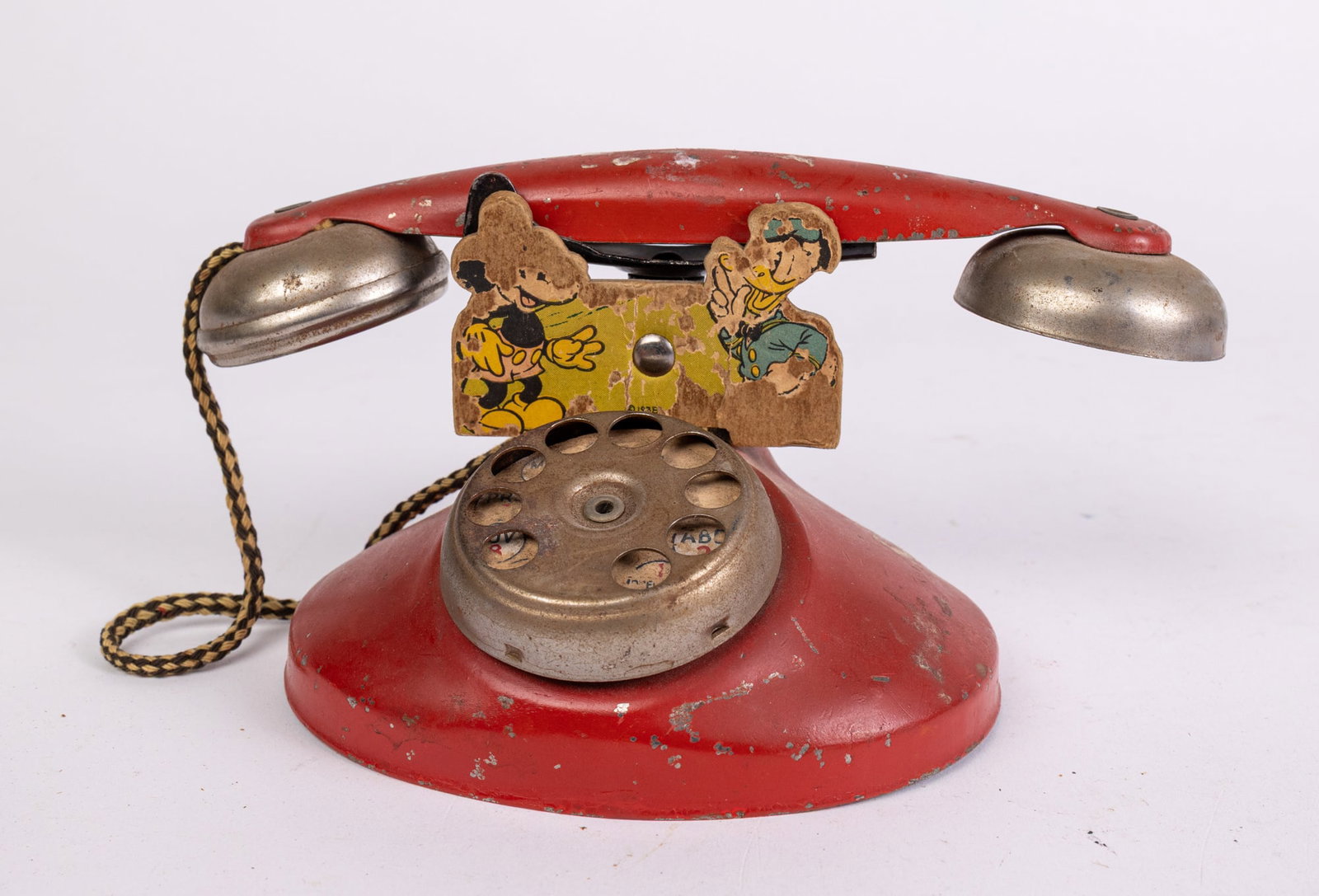 c. 1939 N.N. Hill Brass Co. Mickey & Donald Tin Rotary Telephone Toy: c. 1939 N.N. Hill Brass Co. Mickey & Donald Tin Rotary Telephone Toy Size 5" x 8" Literature Brooks Auction is not responsible for outbids. Questions? Call the office at (856) 694-2960 or email us d