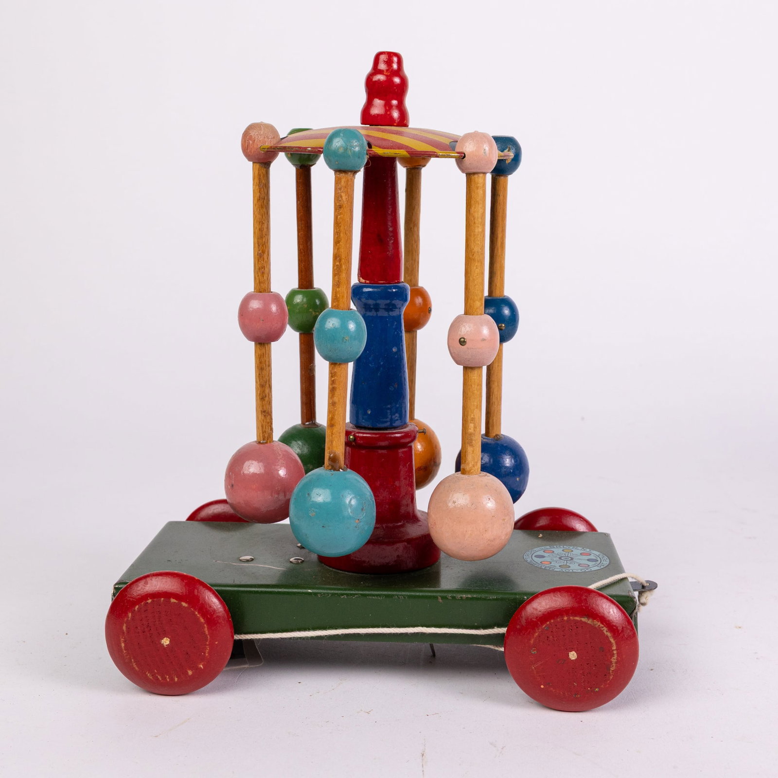 c.1927 Go-Toy Whirly Go Tin & Wood Pull Toy: c.1927 Go-Toy Whirly Go Tin & Wood Pull Toy Size 9" x 7" x 4" Literature Brooks Auction is not responsible for outbids. Questions? Call the office at (856) 694-2960 or email us directly at info@broo