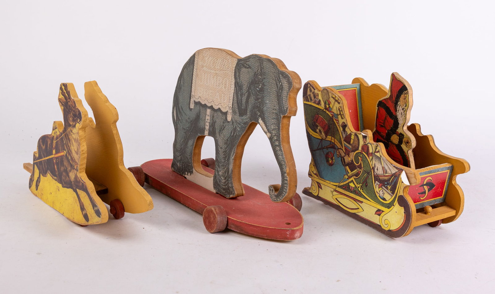 Paper on Wood Pull Toys ft. Santa's Sleigh: Paper on Wood Pull Toys ft. Santa's Sleigh Size 7" x 12" x 12" Literature Brooks Auction is not responsible for outbids. Questions? Call the office at (856) 694-2960 or email us directly at info@bro