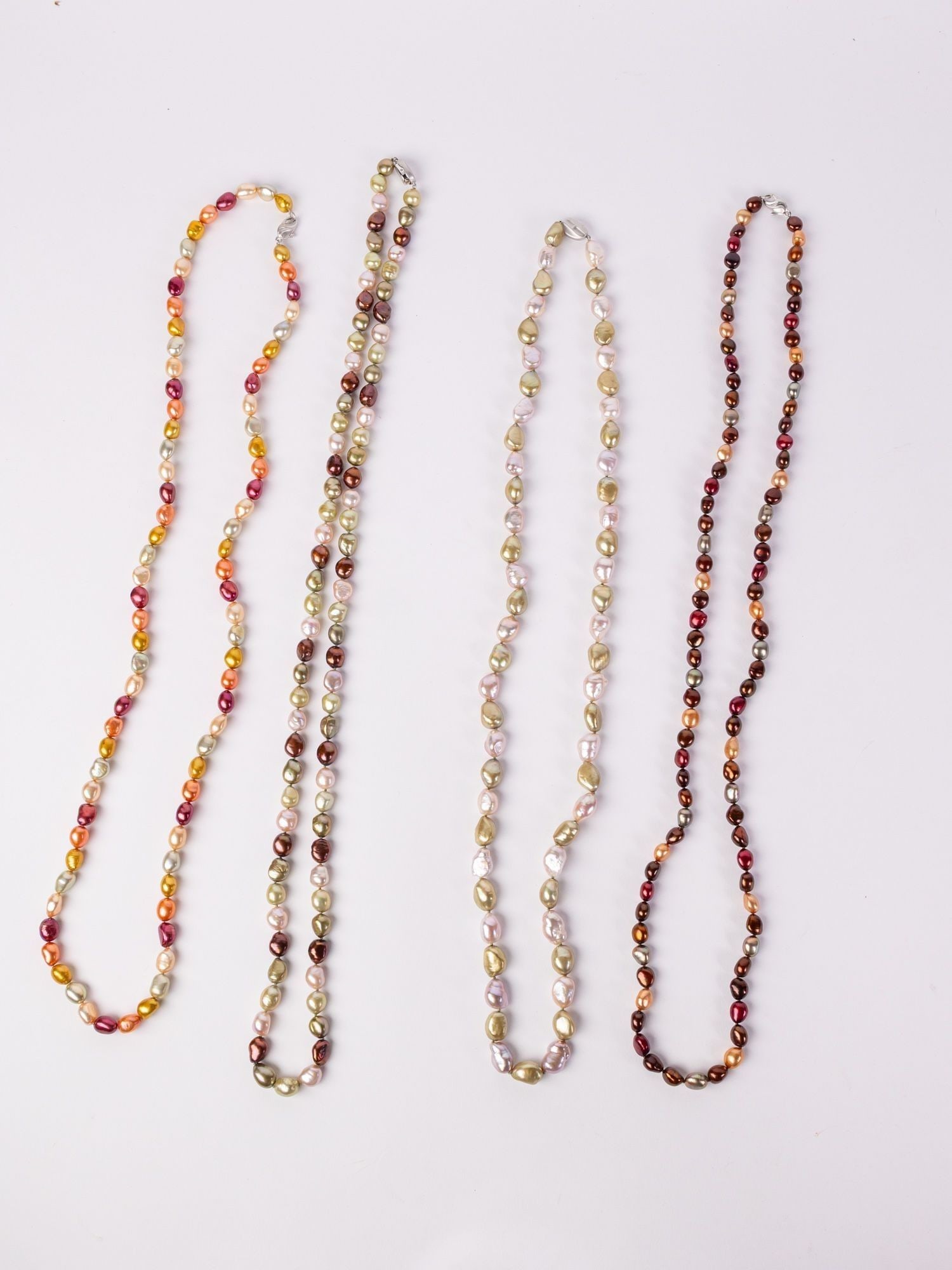 Four Chinese Freshwater Pearl Necklaces: (4) Chinese Freshwater Pearl Necklaces: According to the Attached Estate Appraisal: Four stamped 925 silver lady's necklaces. Condition is very good. The Chinese freshwater pearl strands measure 36" l