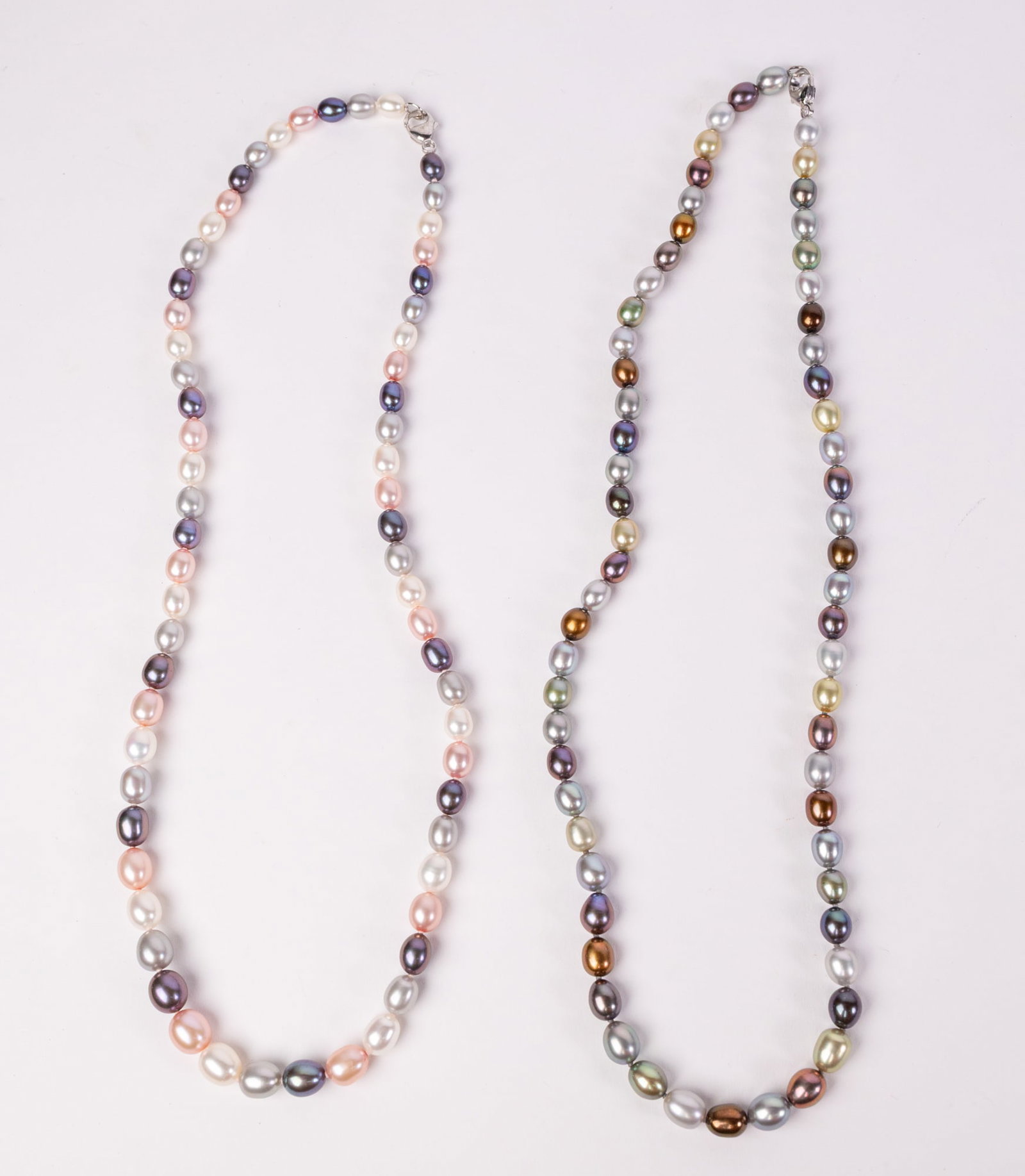 Two Chinese Freshwater Pearl Necklaces: (2) Chinese Freshwater Pearl Necklaces: According to the Attached Estate Appraisal: Two Lady's necklaces with a lobster claw clasp with a bright polish finish. Condition is very good. The two strands 