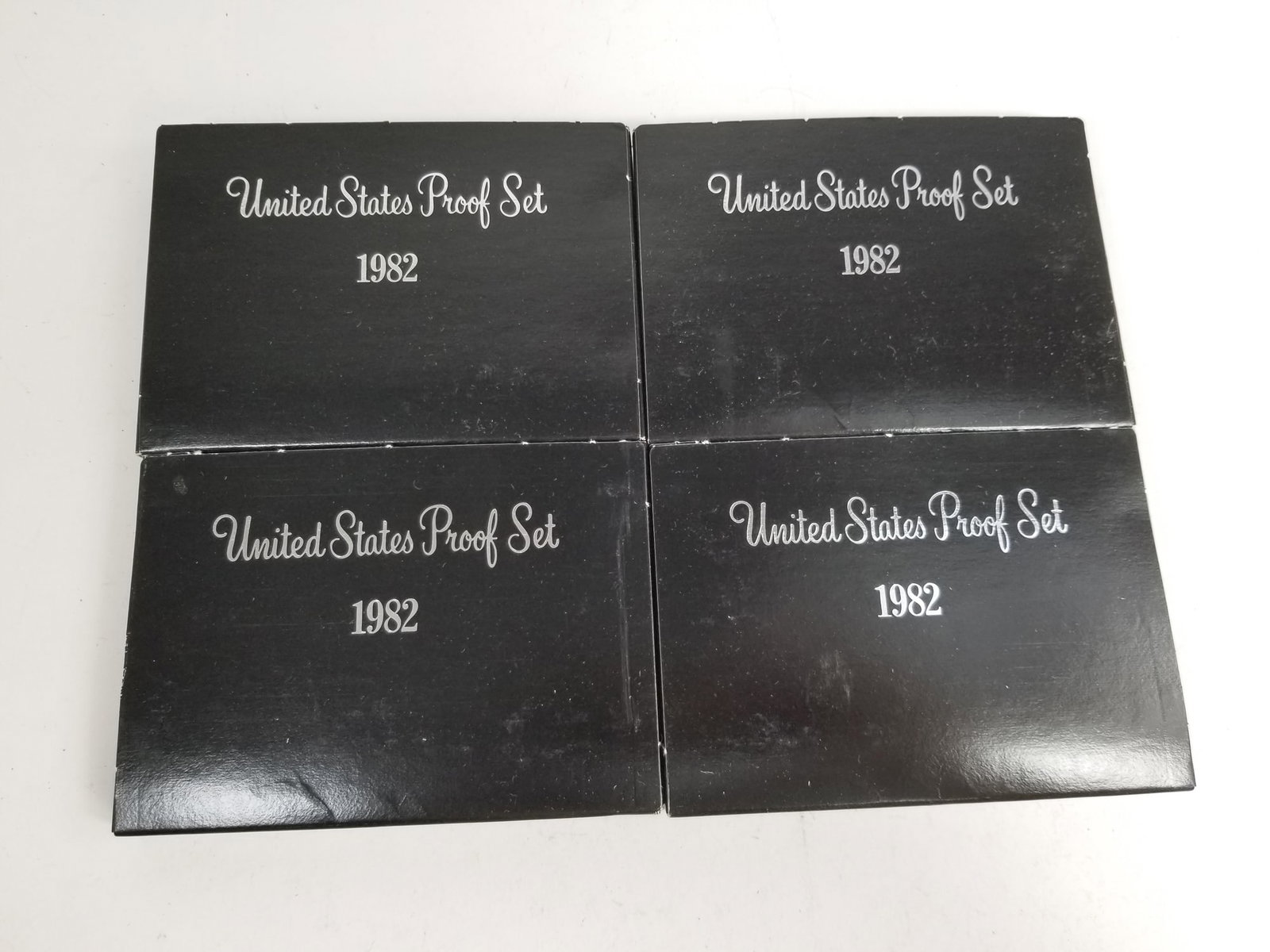 Four 1982 U.S. Proof Sets: (4) 1982 U.S. Proof Sets Literature Brooks Auction is not responsible for outbids. Questions? Call the office at (856) 694-2960 or email us directly at info@brooks.auction. • Please read descrip