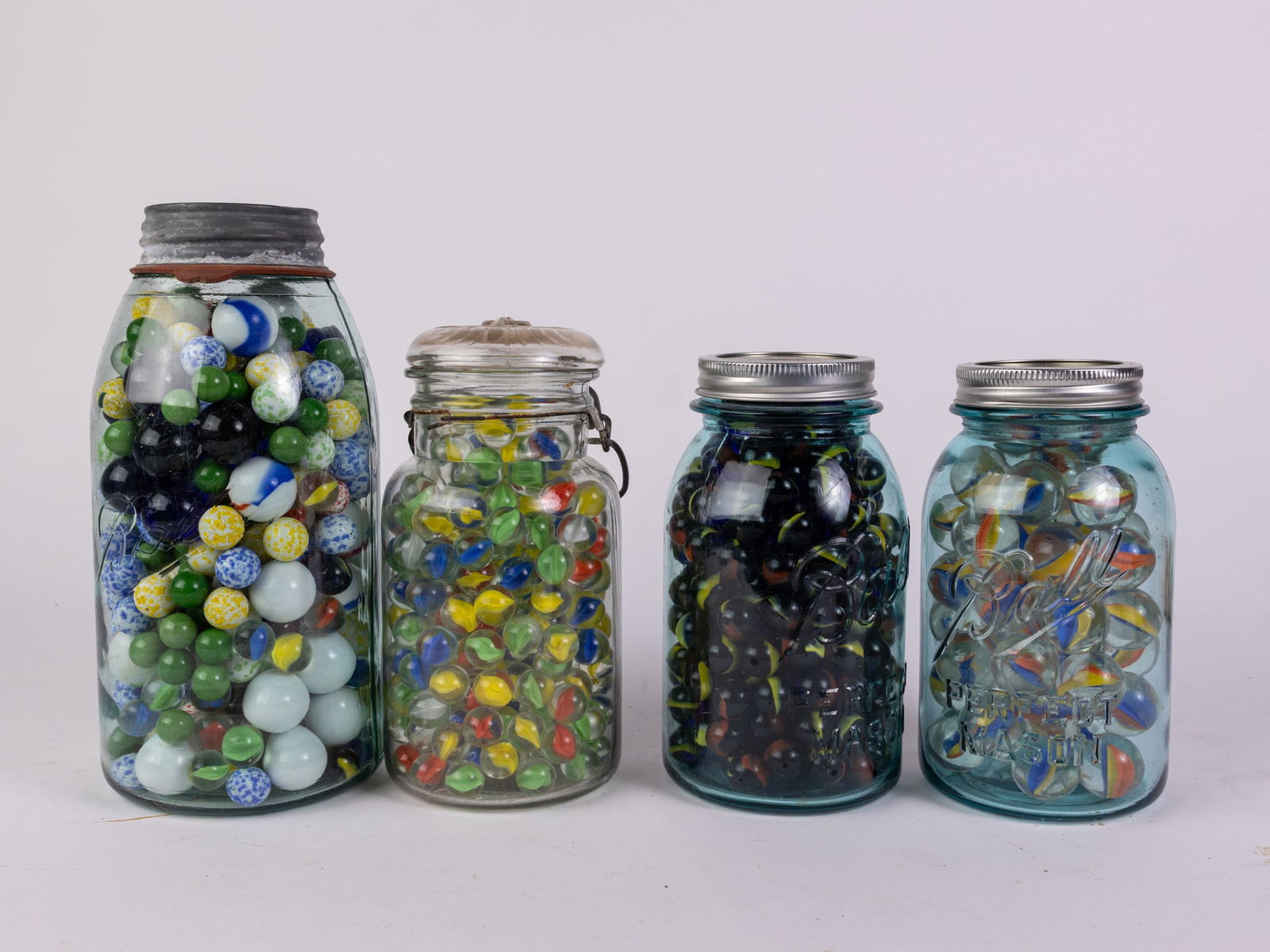 Assortment of Marbles in Mason Jars: Assortment of Marbles in Mason Jars Size 10" H Literature Brooks Auction is not responsible for outbids. Questions? Call the office at (856) 694-2960 or email us directly at info@brooks.auction.