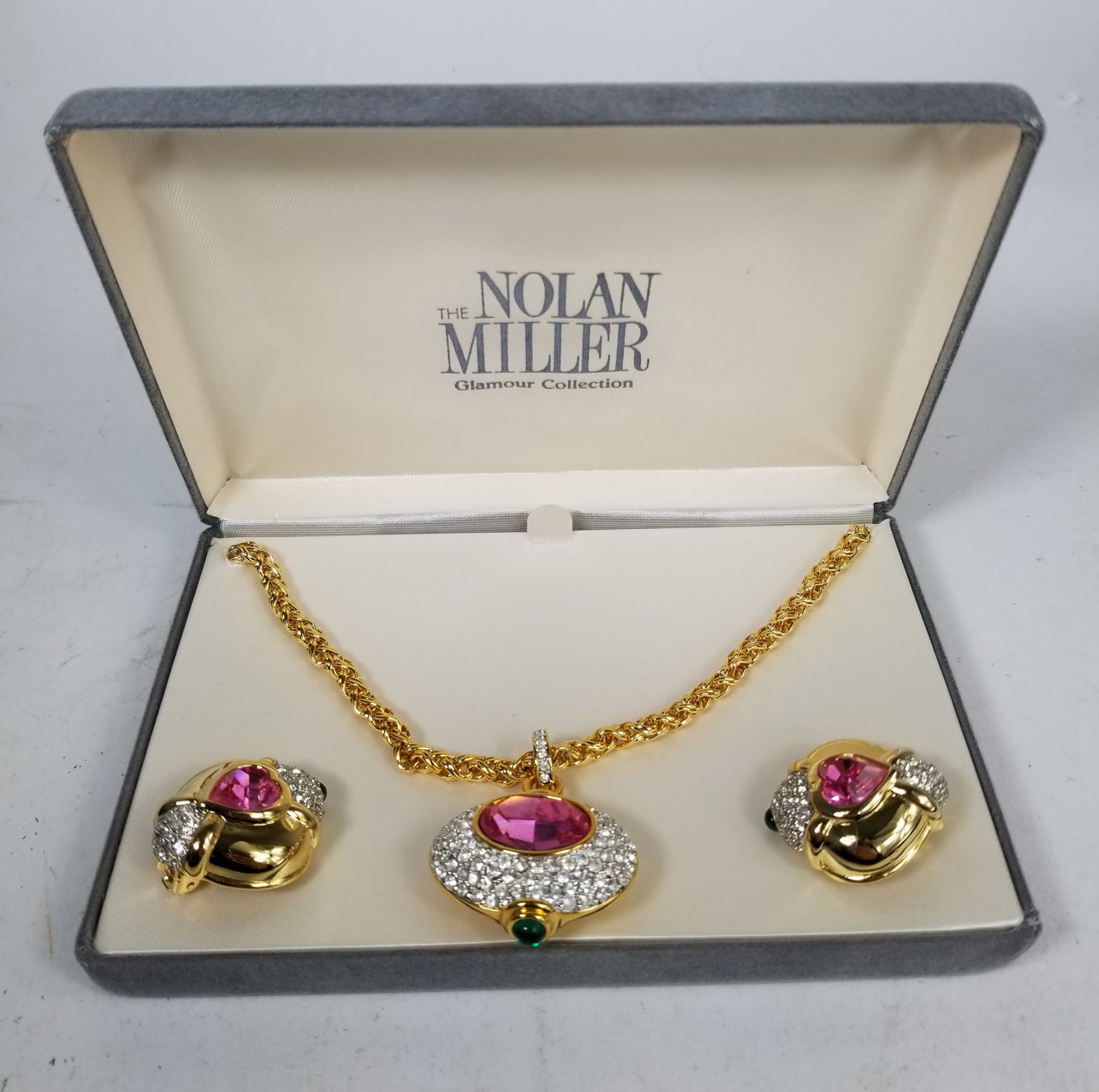 The Nolan Miller Glamour Collection Necklace and Earrings Set in Original Box: The Nolan Miller Glamour Collection Necklace and Earrings Set in Original Box Literature Brooks Auction is not responsible for outbids. Questions? Call the office at (856) 694-2960 or email us directl