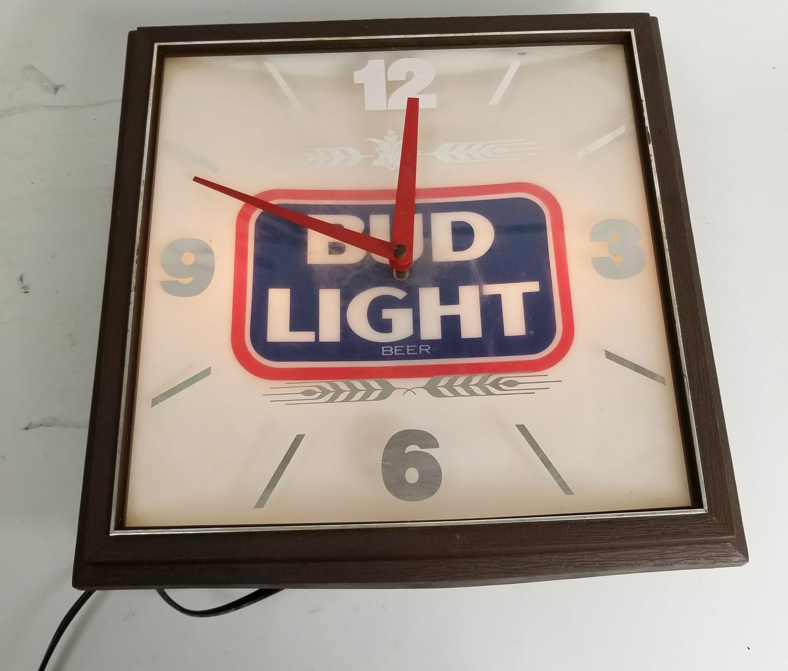 Vintage "Bud Light" Lighted Clock Advertising Bar Sign: Vintage "Bud Light" Lighted Clock Advertising Bar Sign, tested and lights up! Size 14" x 14" x 5" Literature Brooks Auction – Online Auction Terms & Conditions —————
