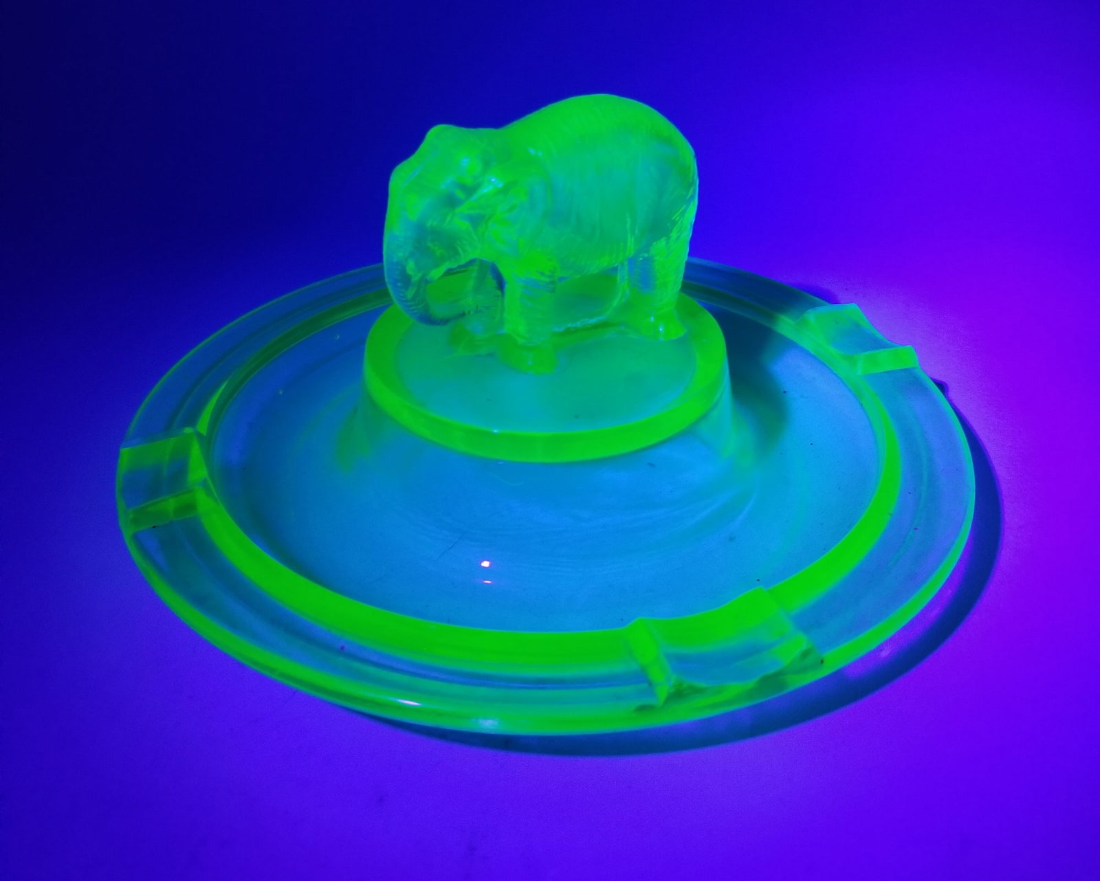 Vintage Uranium Glass Elephant Figural Ashtray: Vintage Uranium Glass Elephant Figural Ashtray Literature Brooks Auction is not responsible for outbids. Questions? Call the office at (856) 694-2960 or email us directly at info@brooks.auction. ̶