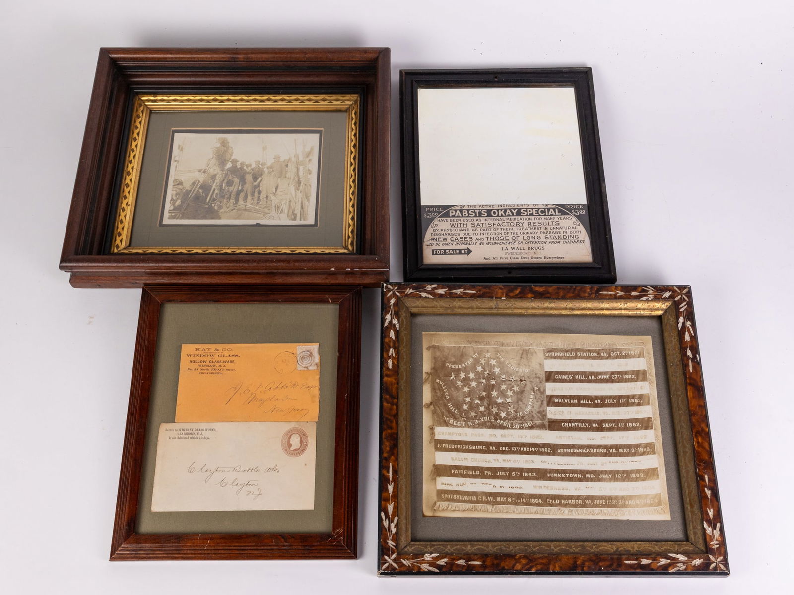Four Framed Antique Items: Four Framed Antique Items: Pabst's Okay Special mirror, likely not an antique mirror - Framed image of commemorative Civil War flag in antique eastlake frame - two framed antique South Jersey glass bl