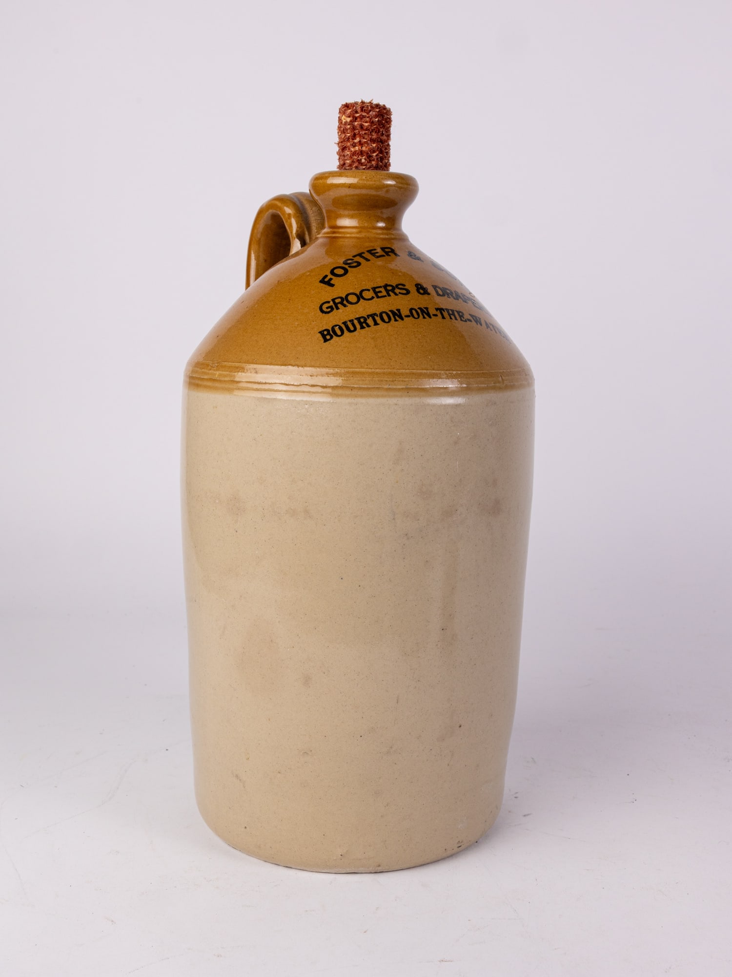 Foster & Son Grocers & Drapers Bourton-on-the-Water Stoneware Jug: Foster & Son Grocers & Drapers Bourton-on-the-Water Stoneware Jug Size 15" H Literature Brooks Auction – Online Auction Terms & Conditions ————————