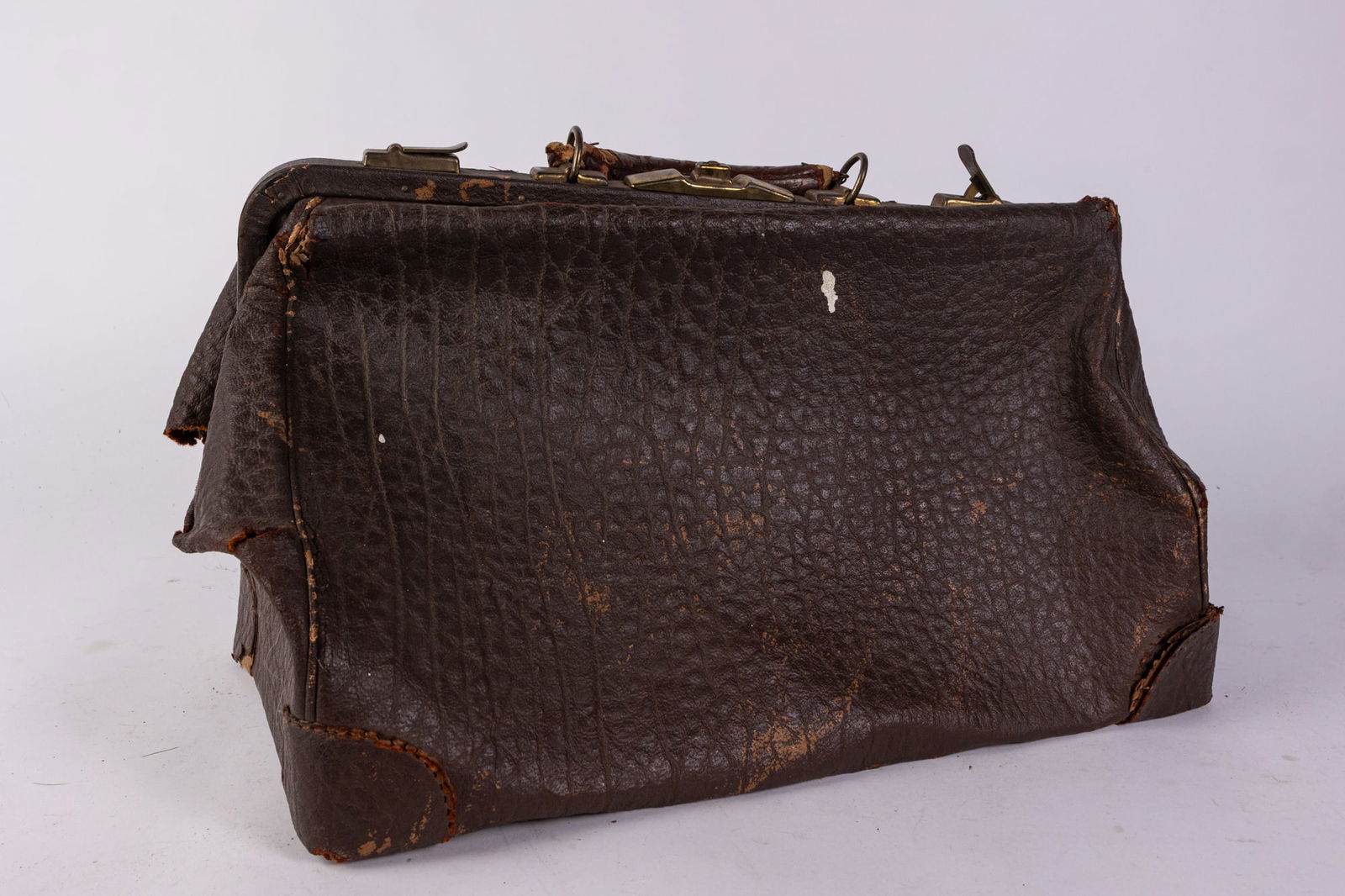 Antique Leather Travel Bag: Antique Leather Travel Bag Size 12" H Literature Brooks Auction is not responsible for outbids. Questions? Call the office at (856) 694-2960 or email us directly at info@brooks.auction. ̶