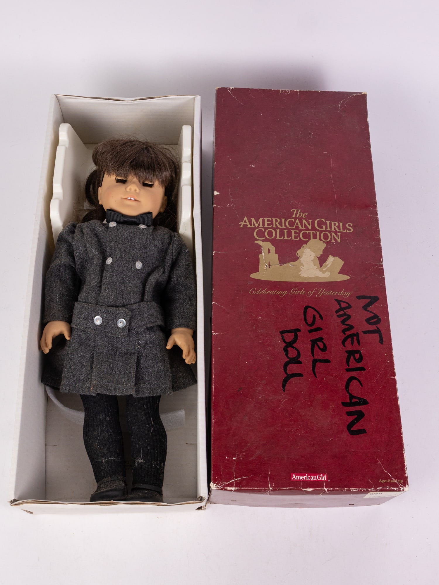 American Girl Doll "Samantha" in Box: American Girl Doll "Samantha" in Box, vintage Samantha doll in original grey outfit. Doll is in reasonably good condition, appears to have not been played with. Box is in poor condition and defaced wi