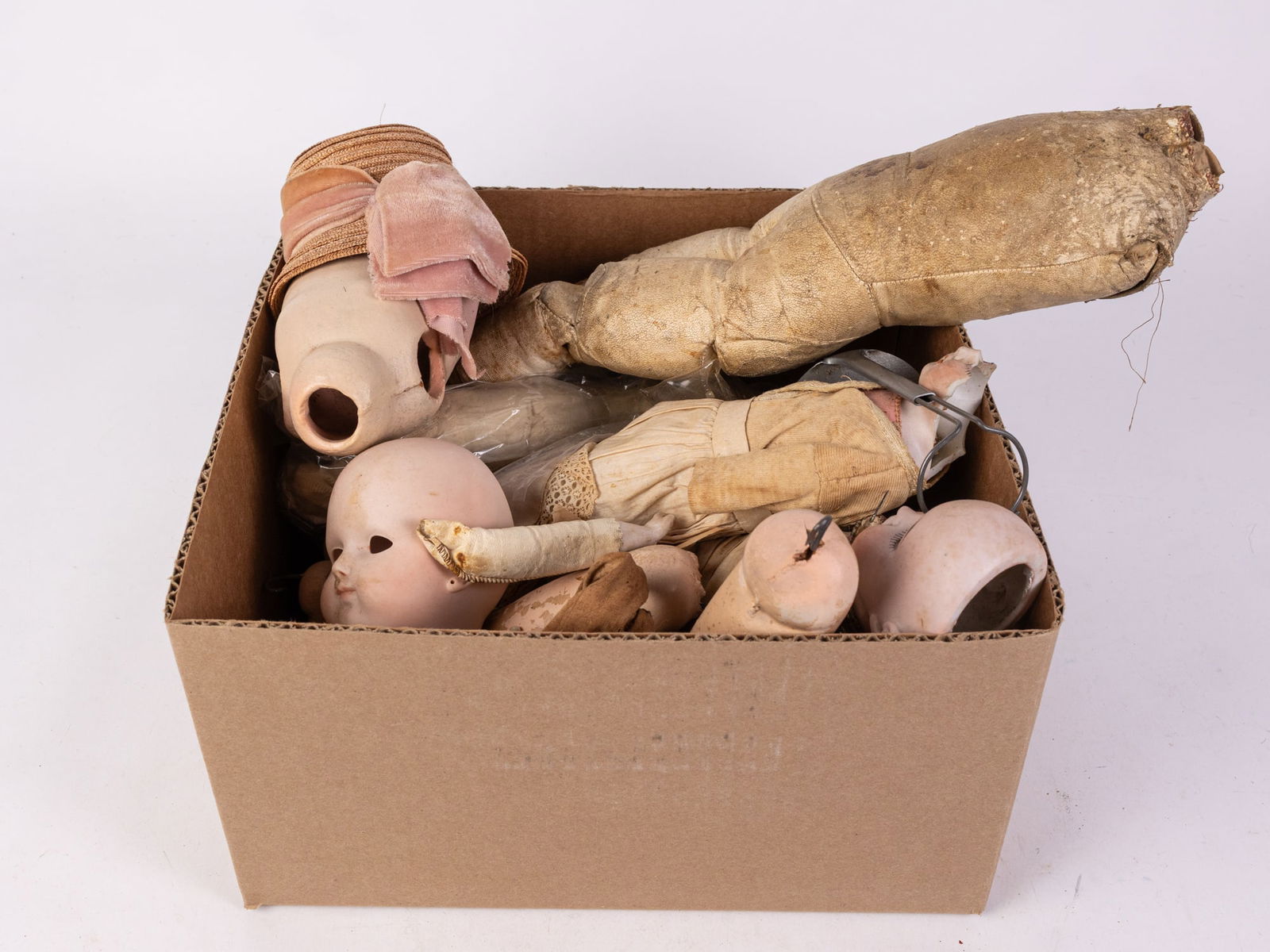 Antique Bisque Doll Assorted Parts: Antique Bisque Doll Assorted Parts Size 7" x 12" x 12" (box size) Literature Brooks Auction is not responsible for outbids. Questions? Call the office at (856) 694-2960 or email us directly at info@