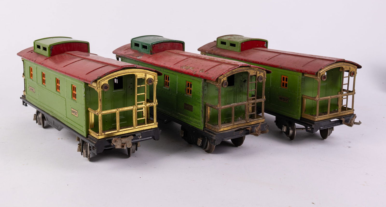 Three Lionel Prewar No.517 Green & Red Freight Cabooses (1 of 5)