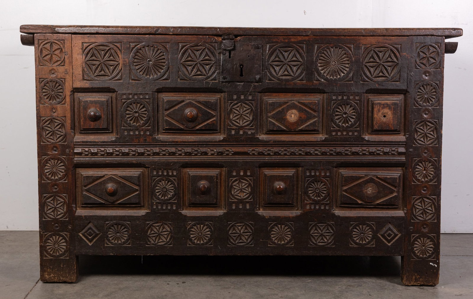 18th Century Spanish Baroque Trunk/Coffer: With intricate carvings and strong, elegant form. This rare piece combines historical character with ornate craftsmanship, making it a prized addition for collectors of European antiques. The top of t