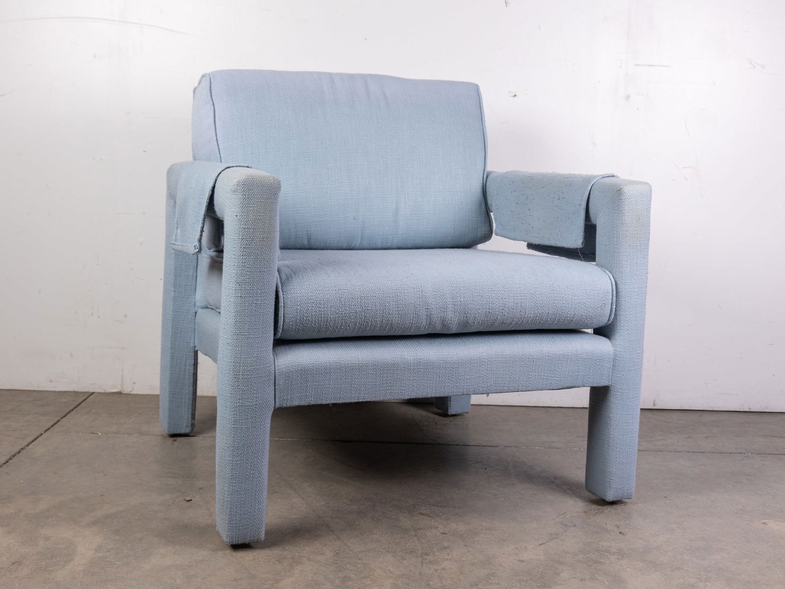 Milo Baughman | Light Blue Parsons Lounge Armchair: Sleek mid-century modern design by Milo Baughman. Featuring light blue upholstery and clean, tailored lines. Size 29" x 29" x 28" Literature BROOKS AUCTION WILL RE-OPEN JANUARY 5TH FOR PREVIEW All