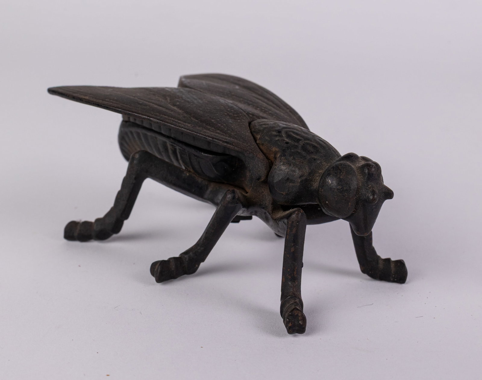 Simpson Iron Co. | c.1890 Cast Iron Fly Advertising Match Safe: This match safe features a figural “fly” motif, emblematic of the whimsical and utilitarian promotional objects of the Victorian era. Cast iron match safes were designed to protect wooden