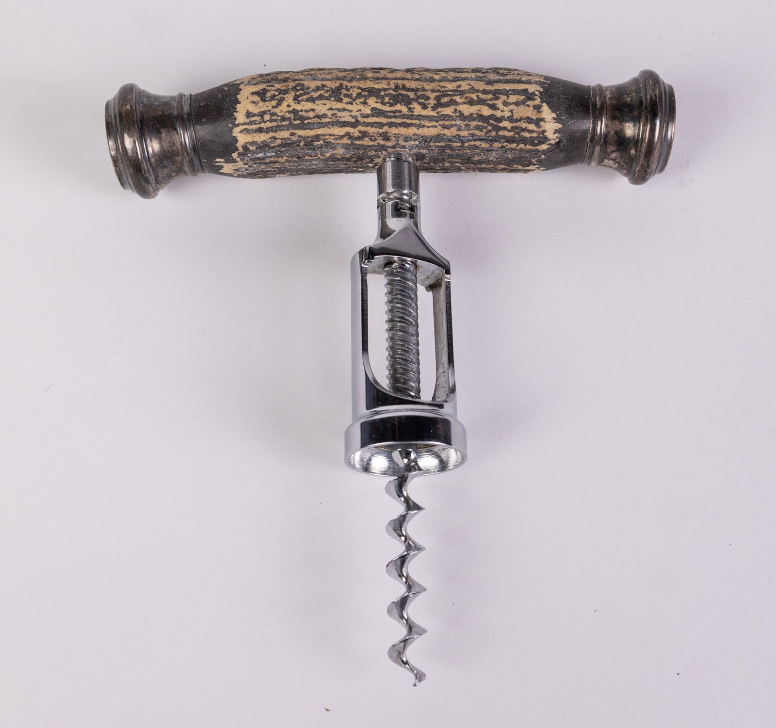 Sterling Silver & Stag Horn Antler Wine Corkscrew: Marked Sterling, "R.V" & "1968" in the manner of John Hasselbring. Mechanism Marked germany Size 7" x 7" x 1.5" Literature BROOKS AUCTION WILL RE-OPEN JANUARY 5TH FOR PREVIEW All Inquiries will be