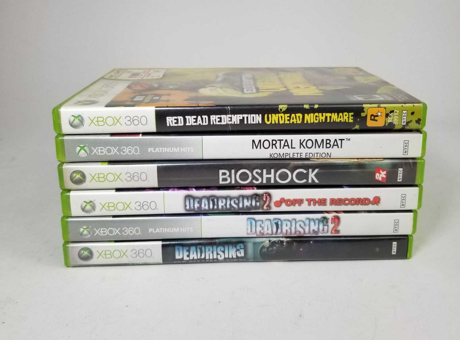 Assorted XBox 360 Games: Assorted XBox 360 Games: Red Dead Redemption Undead Nightmare - Mortal Kombat - Bioshock - assorted Dead Rising games Literature Brooks Auction – Online Auction Terms & Conditions ——
