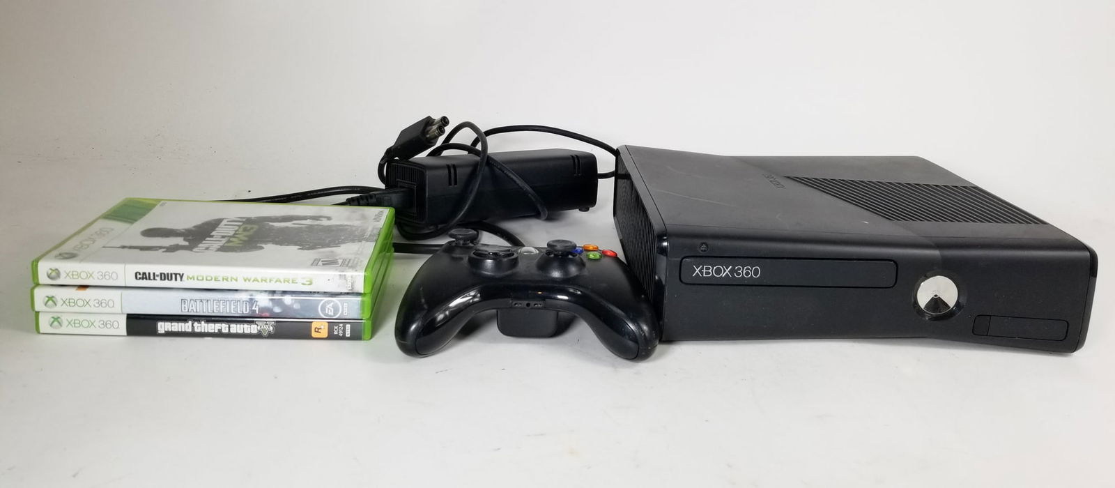 Xbox 360 with Games and Accessories: Xbox 360 with Games and Accessories Size 7" x 12" x 12" Literature Brooks Auction – Online Auction Terms & Conditions ———————————