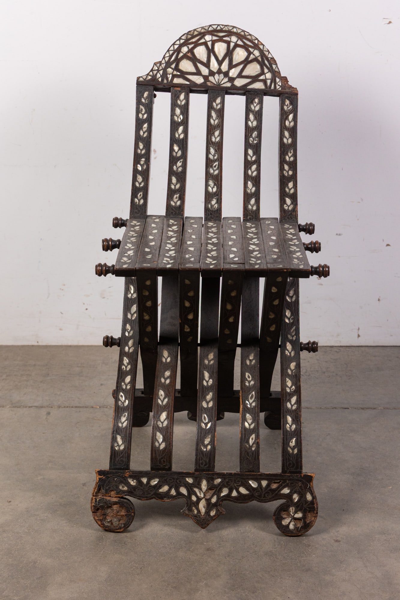 Antique Moorish Folding Chair w/ Mother of Pearl Inlay: Antique Moorish Folding Chair w/ Mother of Pearl InlaySize30" x 15" x 21"Literature Brooks Auction is not responsible for outbids. Questions? Call the office at (856) 694-2960 or email us directly