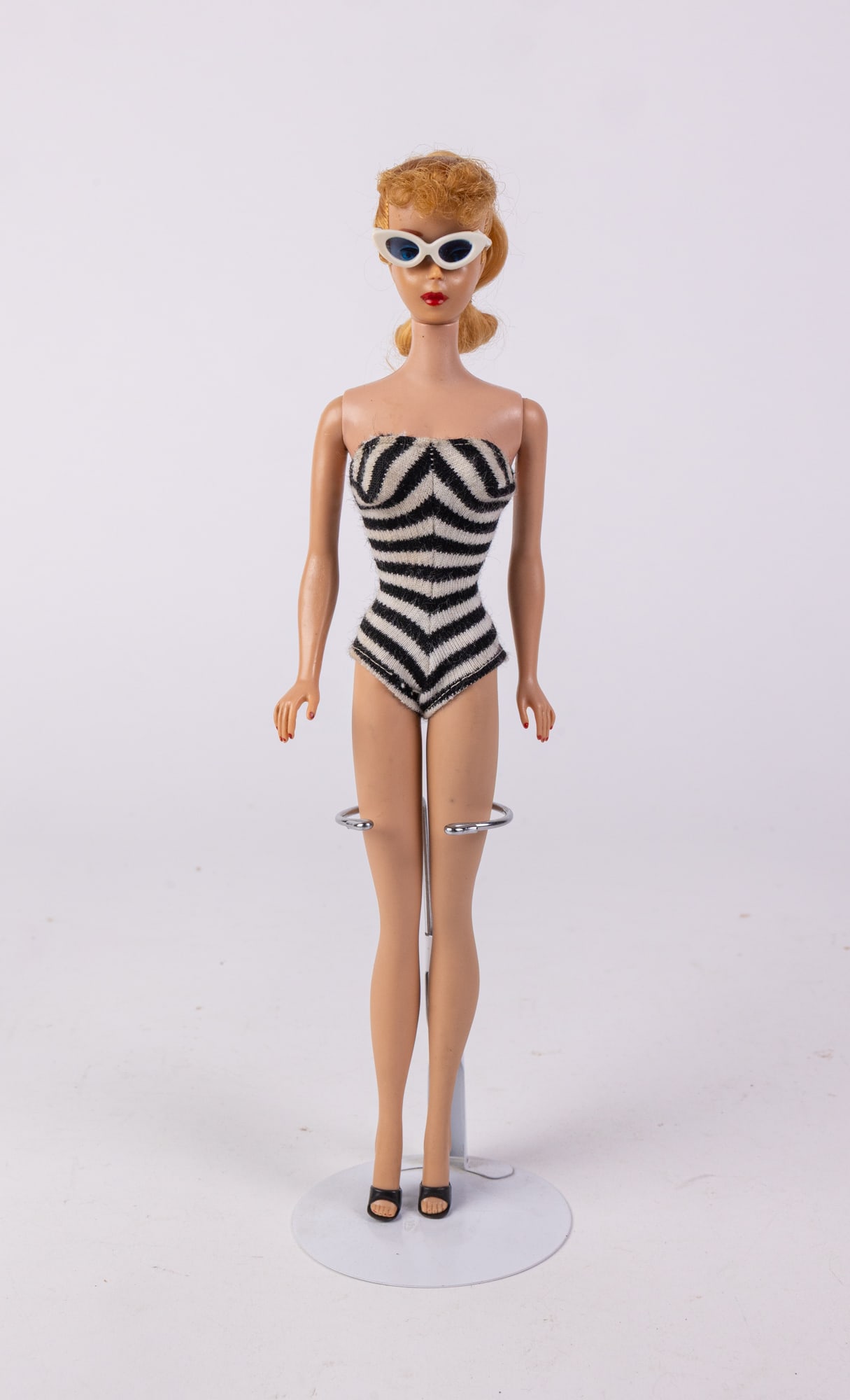 Vintage 1960s Blonde Ponytail Barbie in Zebra Swimsuit: Vintage 1960s Blonde Ponytail Barbie in Zebra SwimsuitSize11.5" HLiterature Brooks Auction is not responsible for outbids. Questions? Call the office at (856) 694-2960 or email us directly at