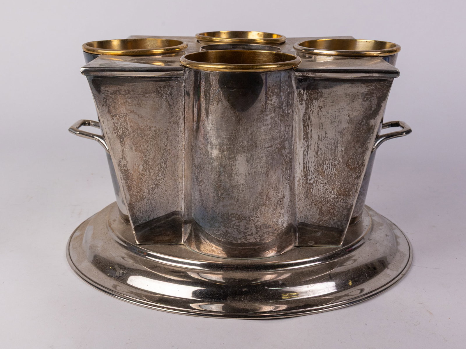 Art Deco Champagne Cooler: Art Deco Champagne Cooler, This art deco champagne cooler is constructed from silver plate and brass and fits four bottles of champagne. It likely dates to the early 20th century and features
