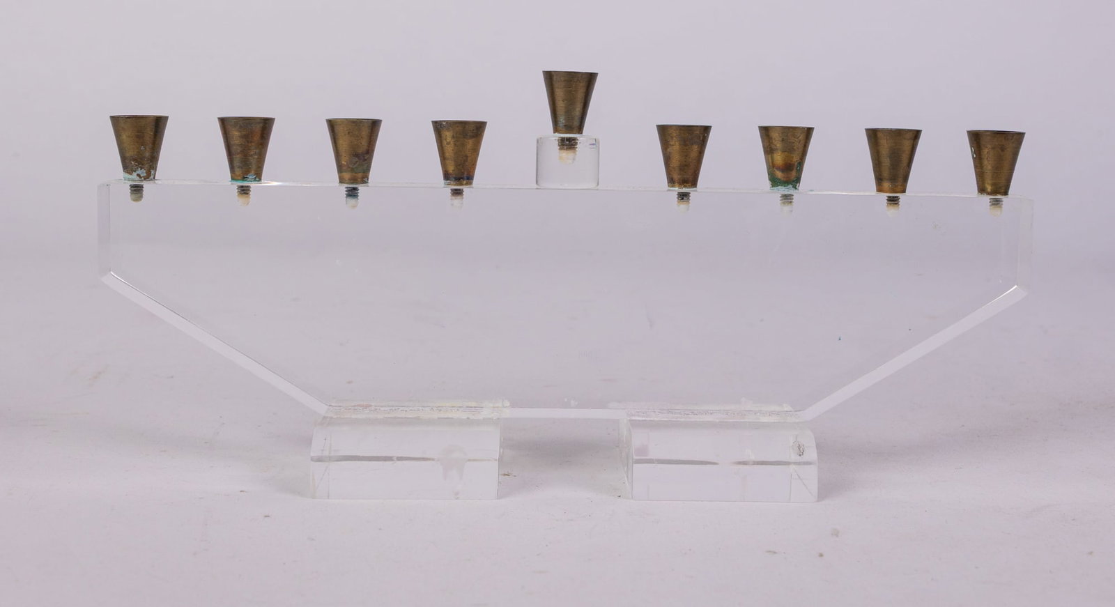 Mid Century Modern Lucite Menorah: Mid Century Modern Lucite MenorahSize4" x 9" x 2"Literature Brooks Auction is not responsible for outbids. Questions? Call the office at (856) 694-2960 or email us directly at info@brooks.auction. 