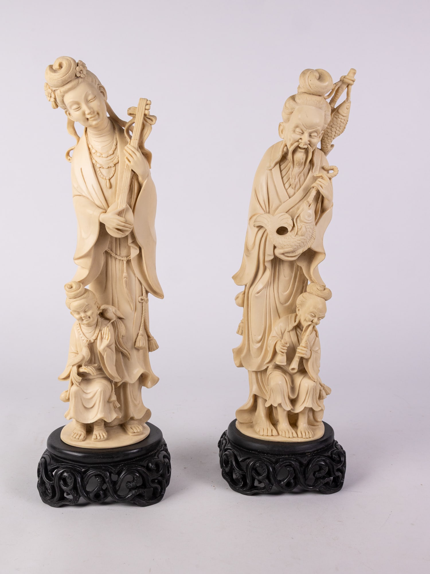 Pair of Carved Asian Figures: Pair of Carved Asian Figures: one figure has a repair pictured on the neck of the instrumentSize17" HLiterature Brooks Auction is not responsible for outbids. Questions? Call the office at (856)