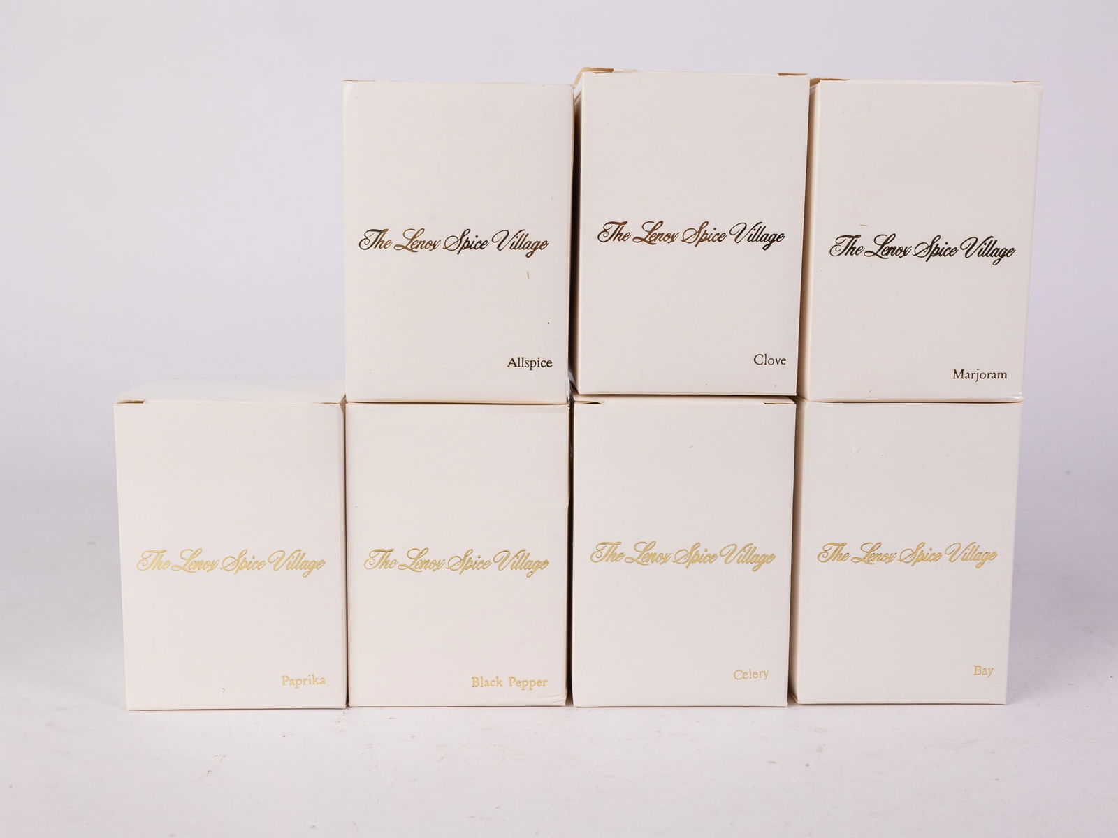 Seven Piece Lenox "Spice Village" Set: Seven Piece Lenox "Spice Village" Set: Marjoram - Clove - Black Pepper - Bay - Celery - Paprika - AllspiceSize10" x 13" x 3"Literature Brooks Auction is not responsible for outbids. Questions? Call